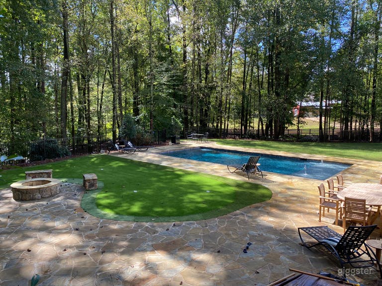  Fire pit, putting green, rock patio and pool
 