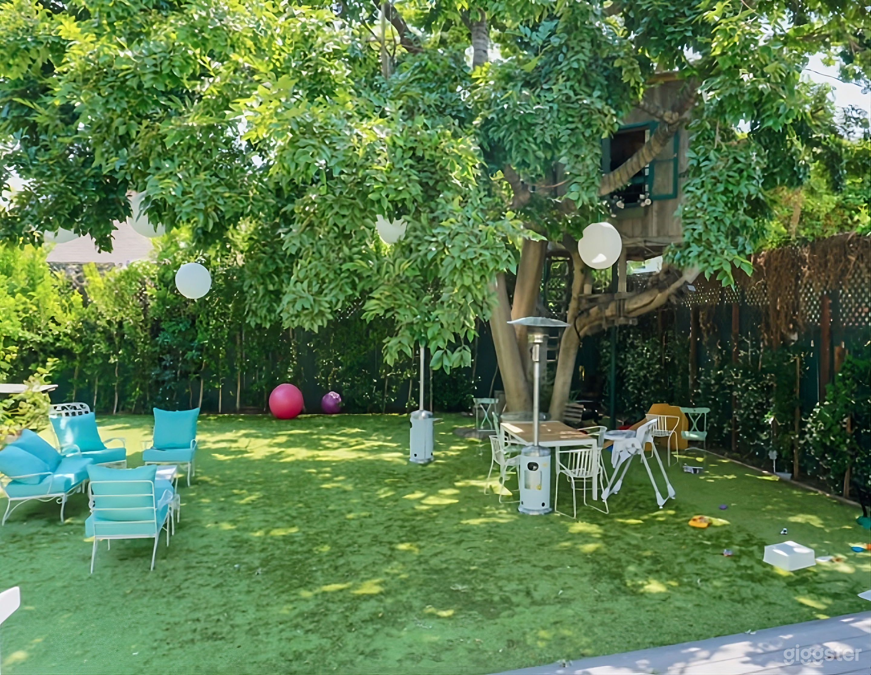 Enchanting Backyard with Treehouse Photo 1