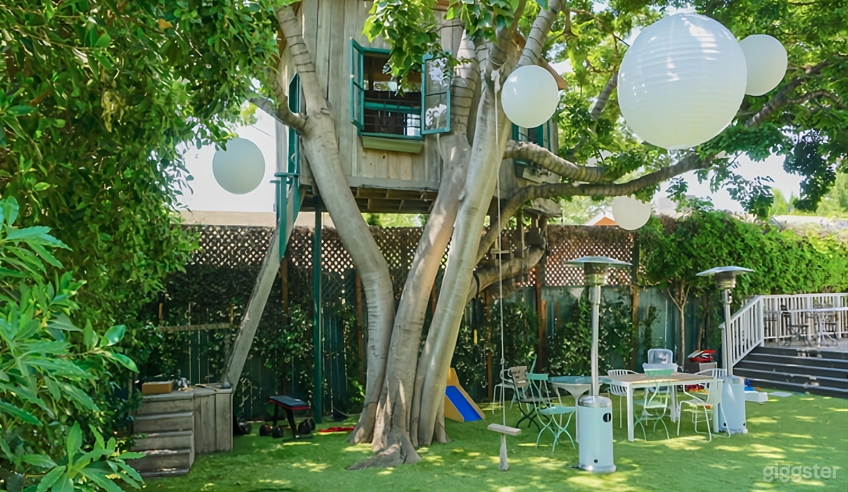 Enchanting Backyard with Treehouse Photo 2