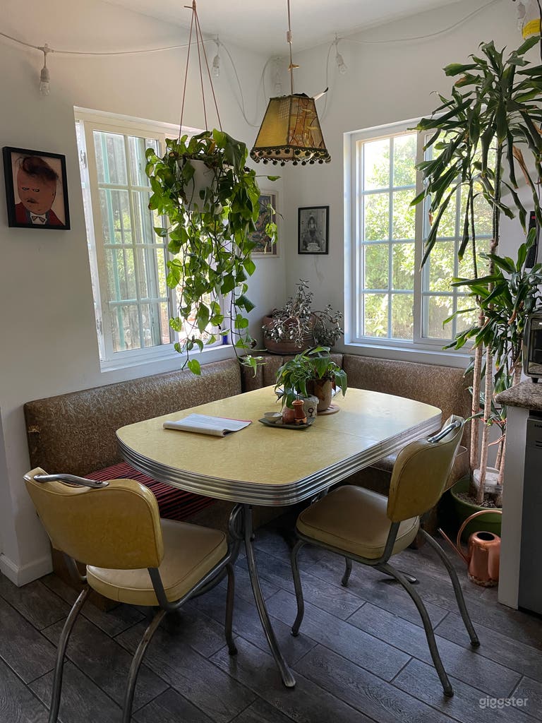  Kitchen nook with banquette and formica table. 