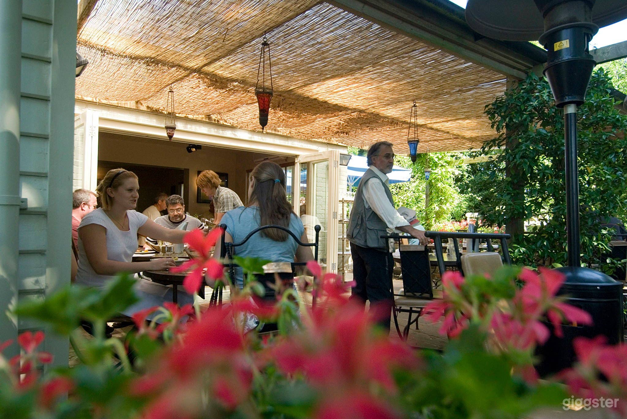 Outdoor Restaurant and Patio with Garden Views Photo 2