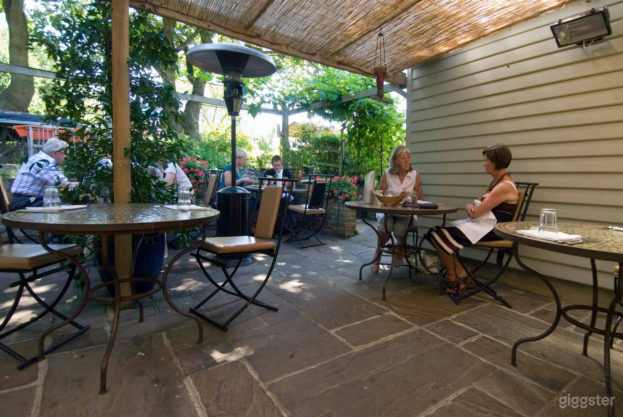 Outdoor Restaurant and Patio with Garden Views Photo 1