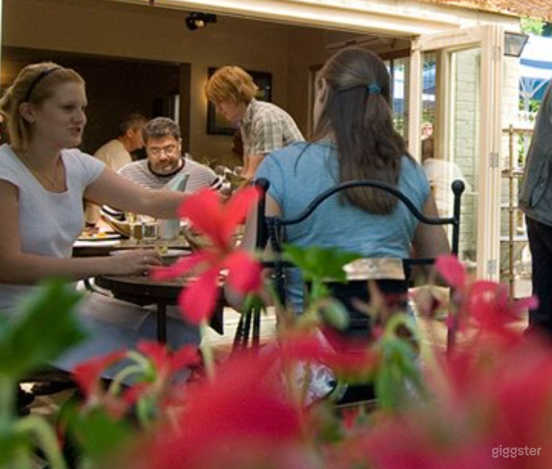 Outdoor Restaurant and Patio with Garden Views Photo 3