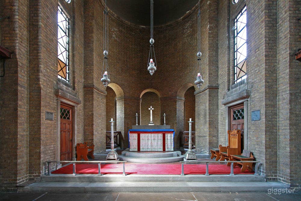 The sanctuary, with working candle lamps and covered altar. The space behind leads to the Lady Chapel.