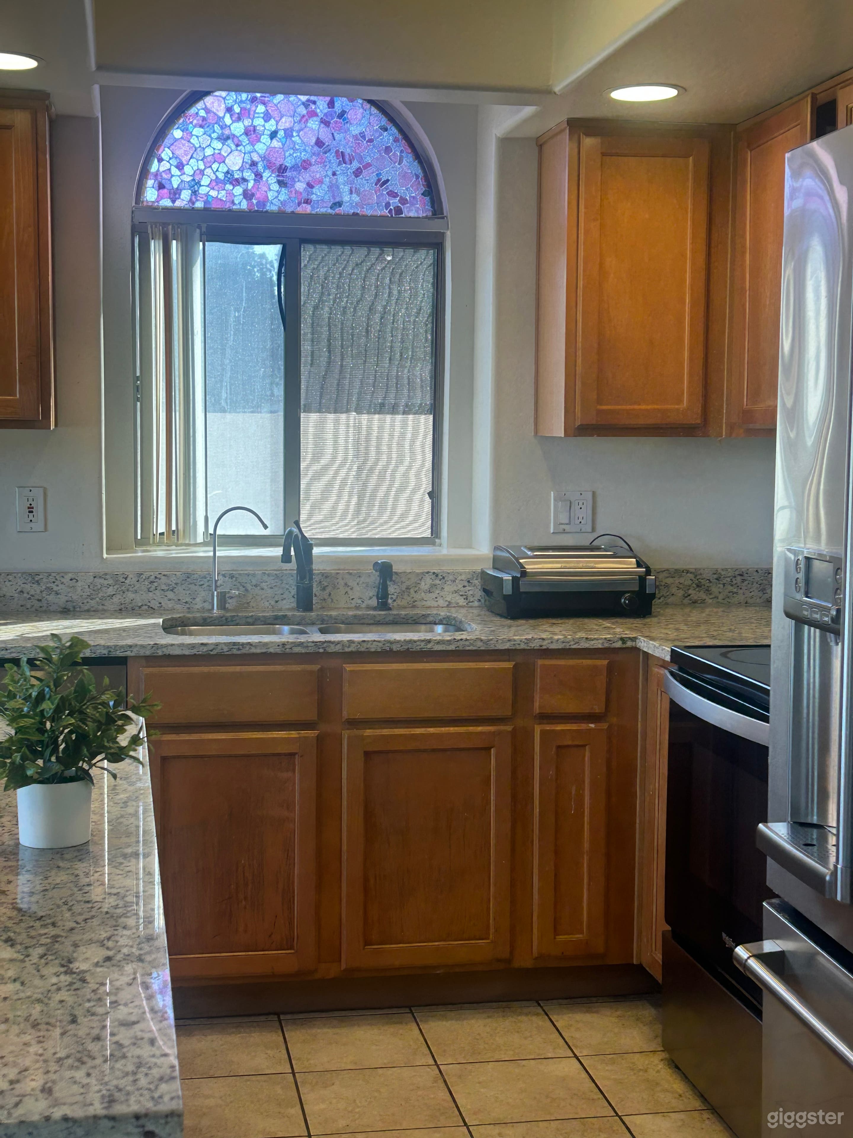 Luxury Chef’s Kitchen with a premium marble island and 86-inch screen. Perfect for professional cooking shows and food photography.