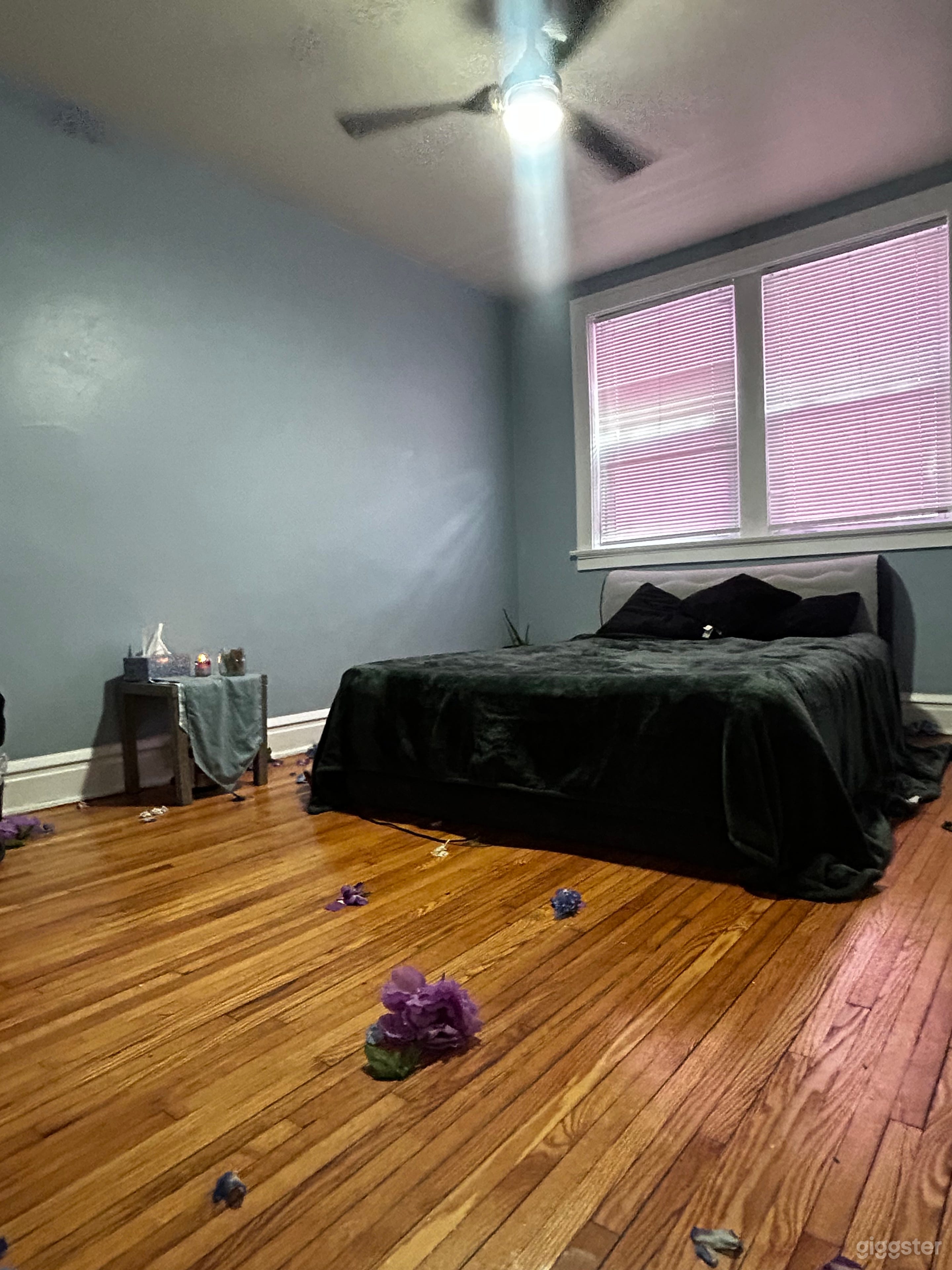 The bedroom setup to the blue room with amazing end table and a chair it’s perfect as a film set and can be moved around to suit your particular needs