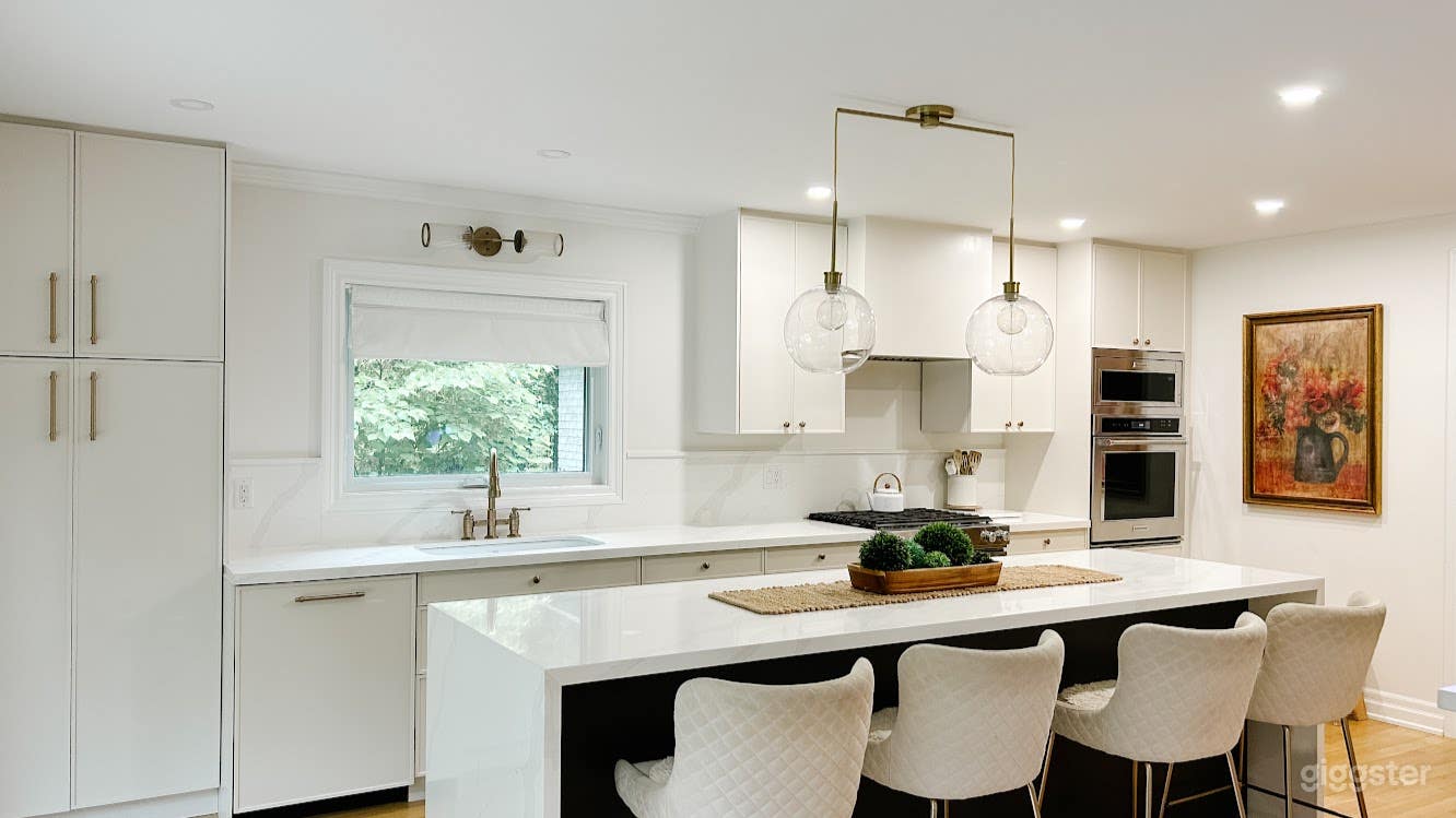 Modern white kitchen island with 4 stools