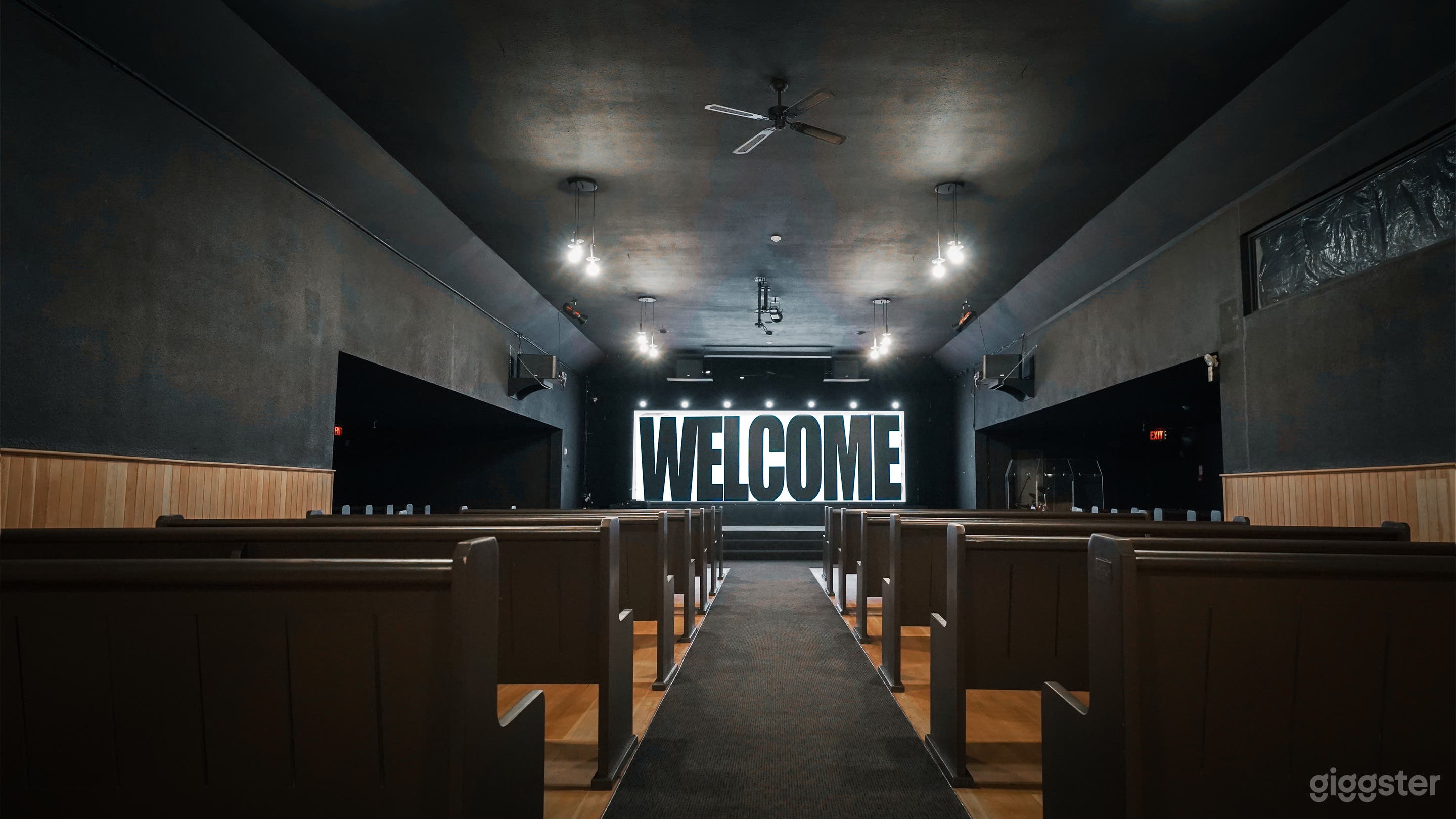 Modern Chapel-Style Event Hall with Stage &amp; Seating Photo 1