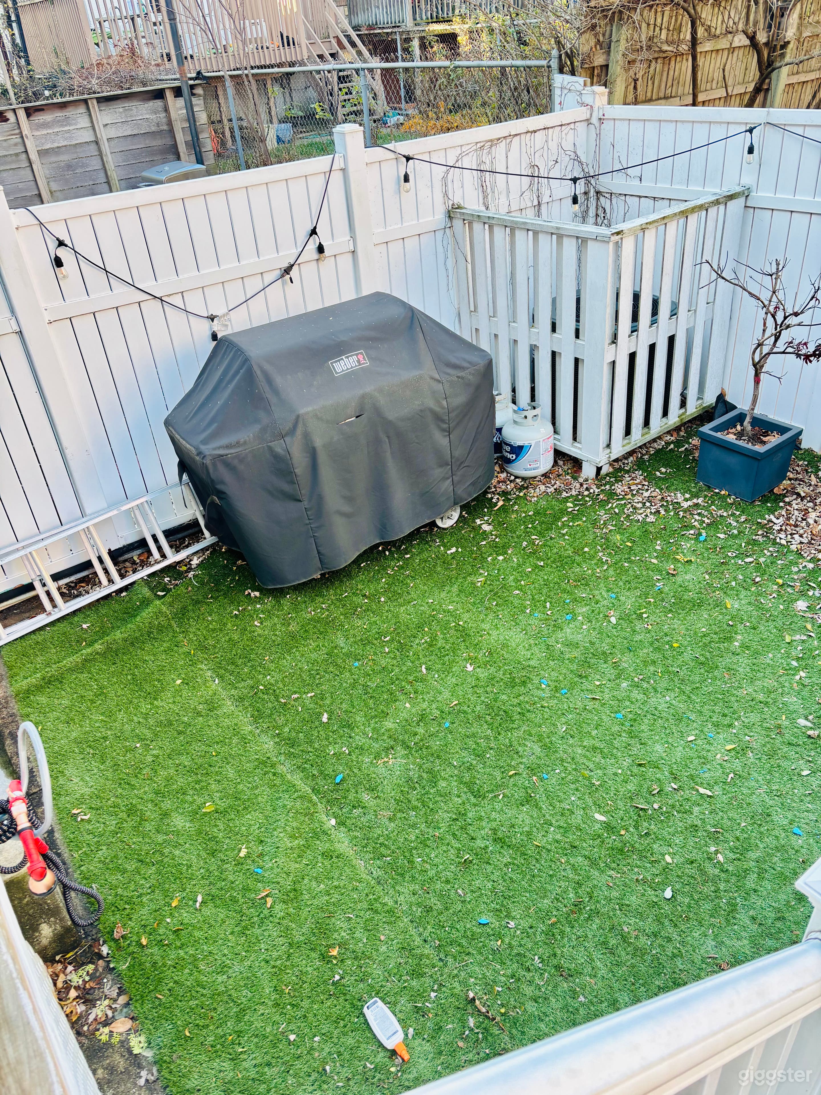 Charming and Cozy Fenced Backyard Photo 3