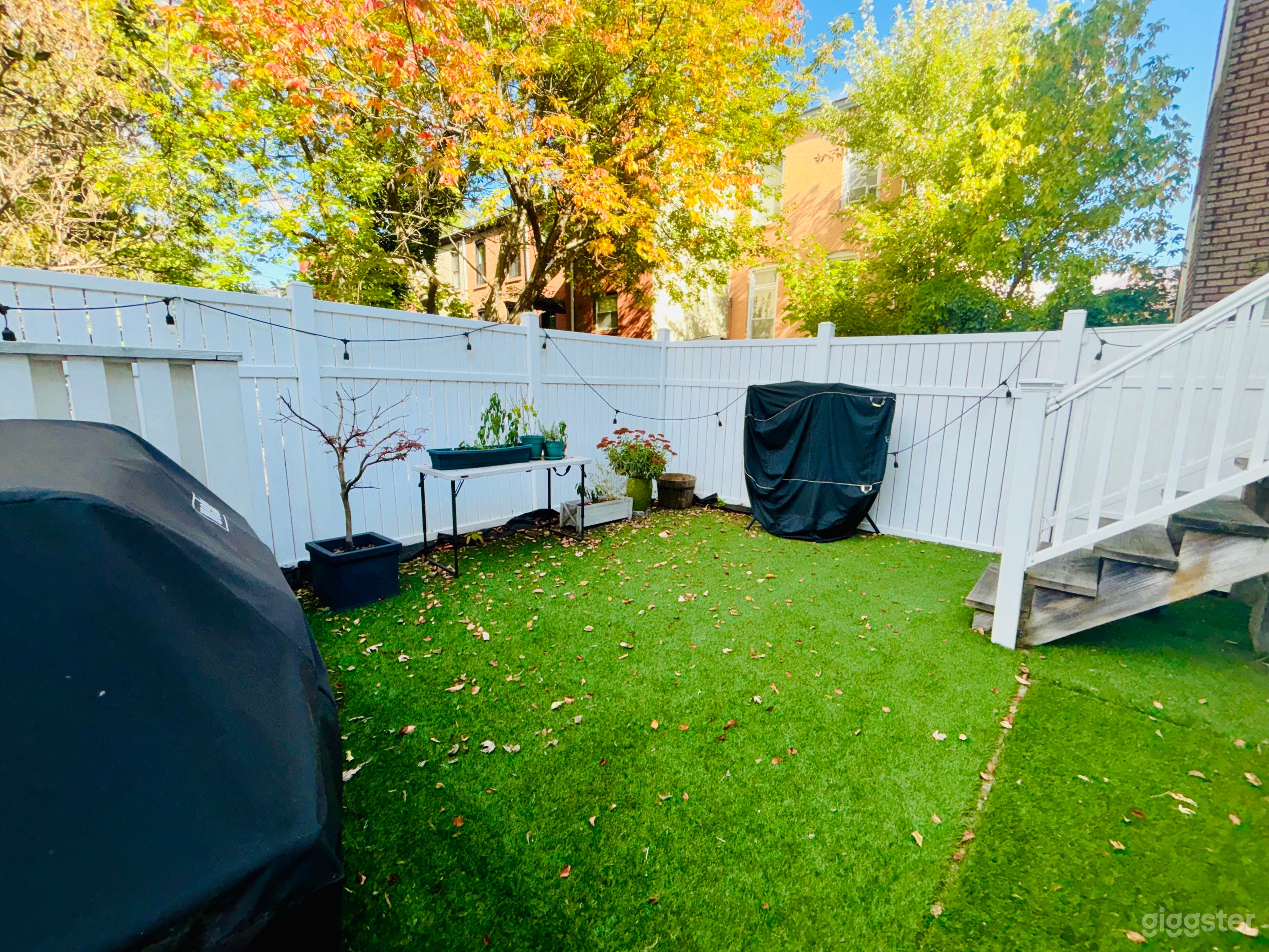 Charming and Cozy Fenced Backyard Photo 1
