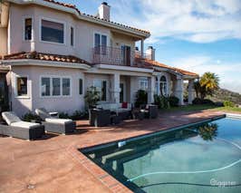  Elegant Pool in a Mediterranean Home perched atop a hill  