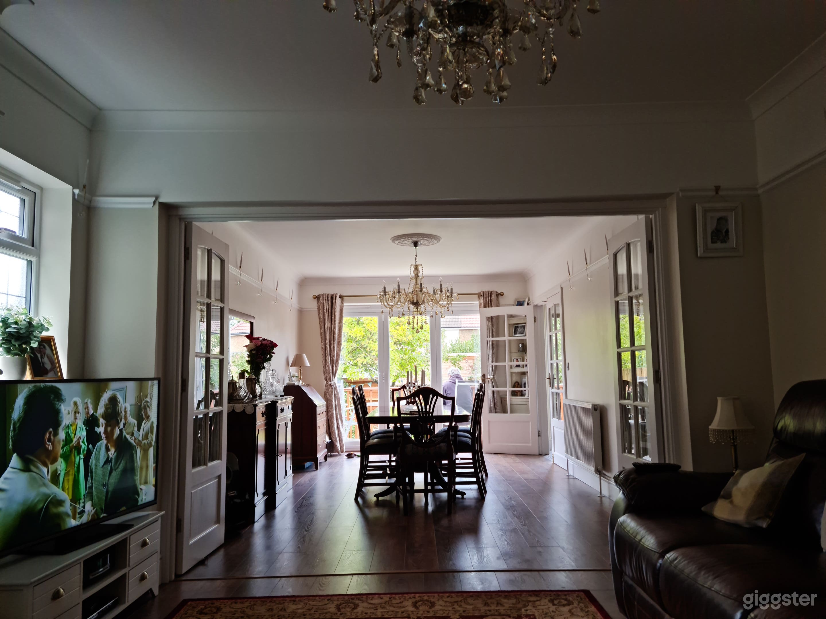 Lounge dinner with marble fire place, bifolds onto the balcony..Bifolding French doors can also separate the two rooms.