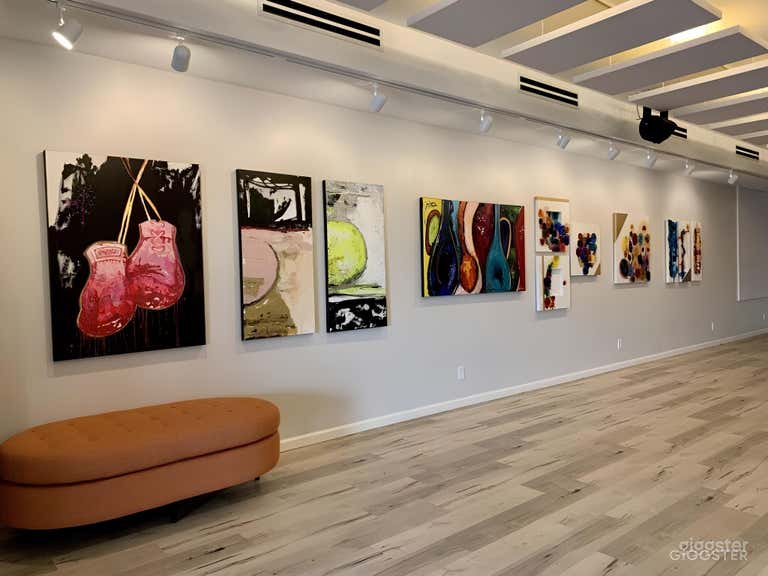  White wood floors with fresh white walls, pops of color with ever-changing local Dallas artists&#x27; artwork sprinkled around the space.  