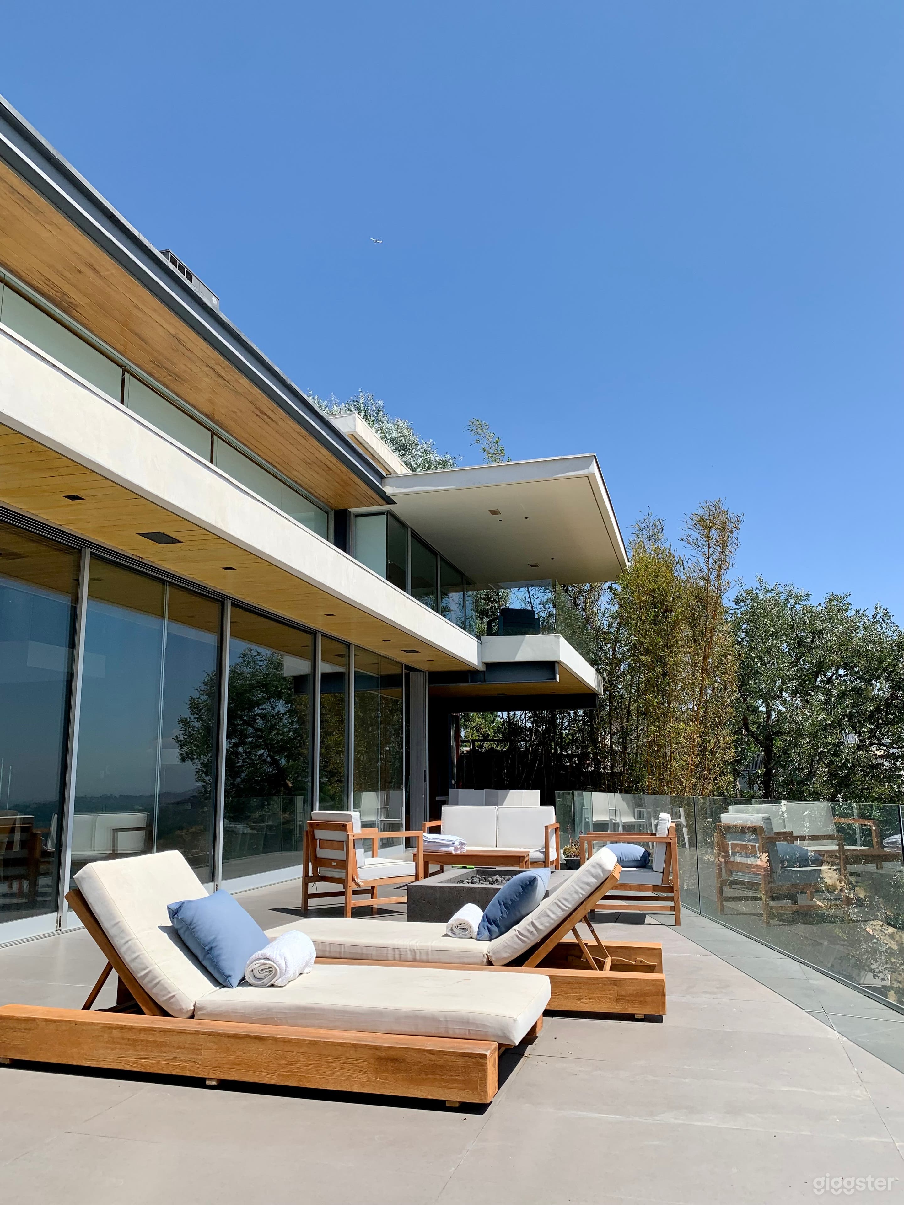 Modern lines showcasing steel, glass, exposed wood and natural stone 