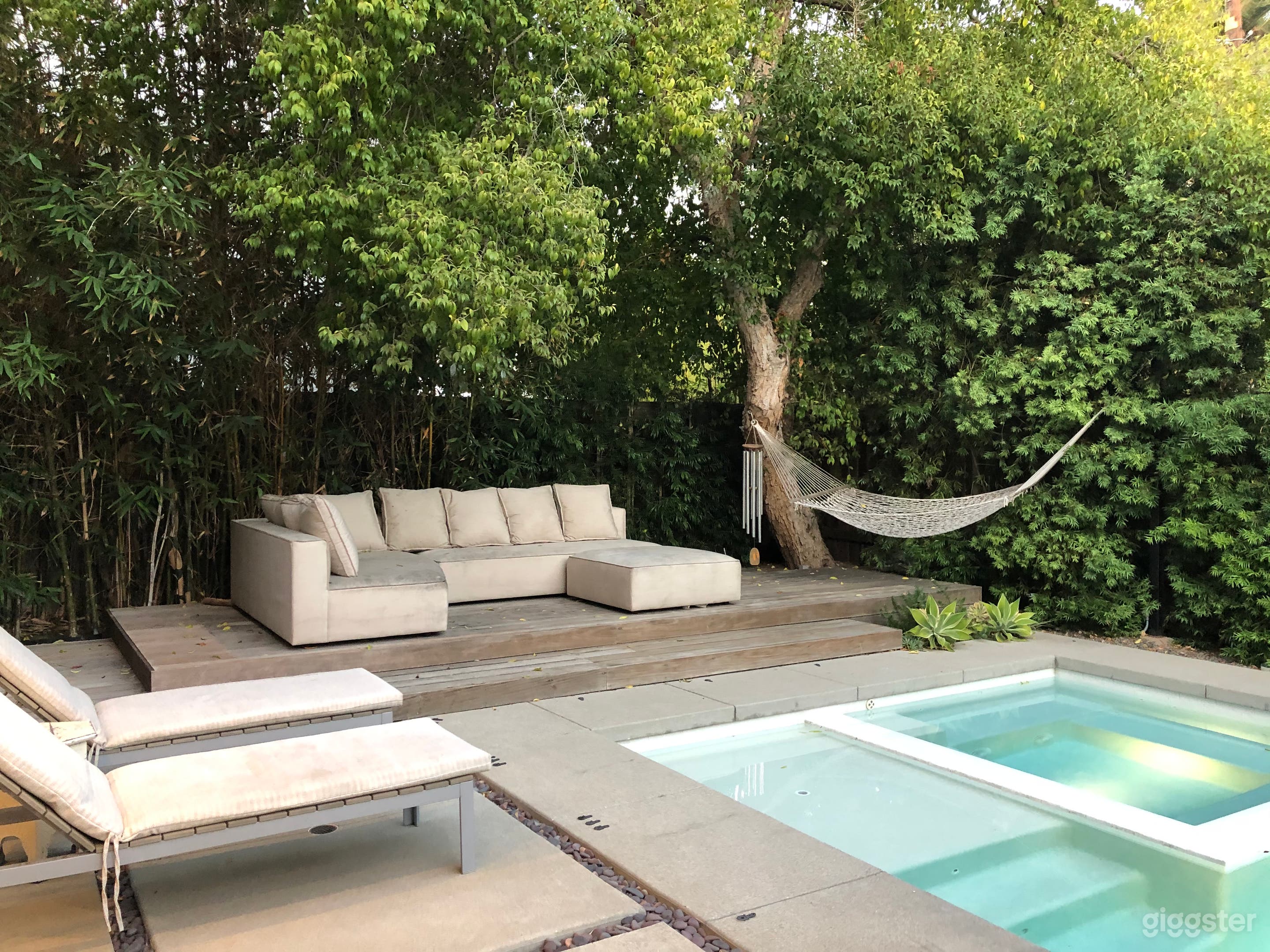 Modern house, pool, trees and green landscaping.  Photo 3