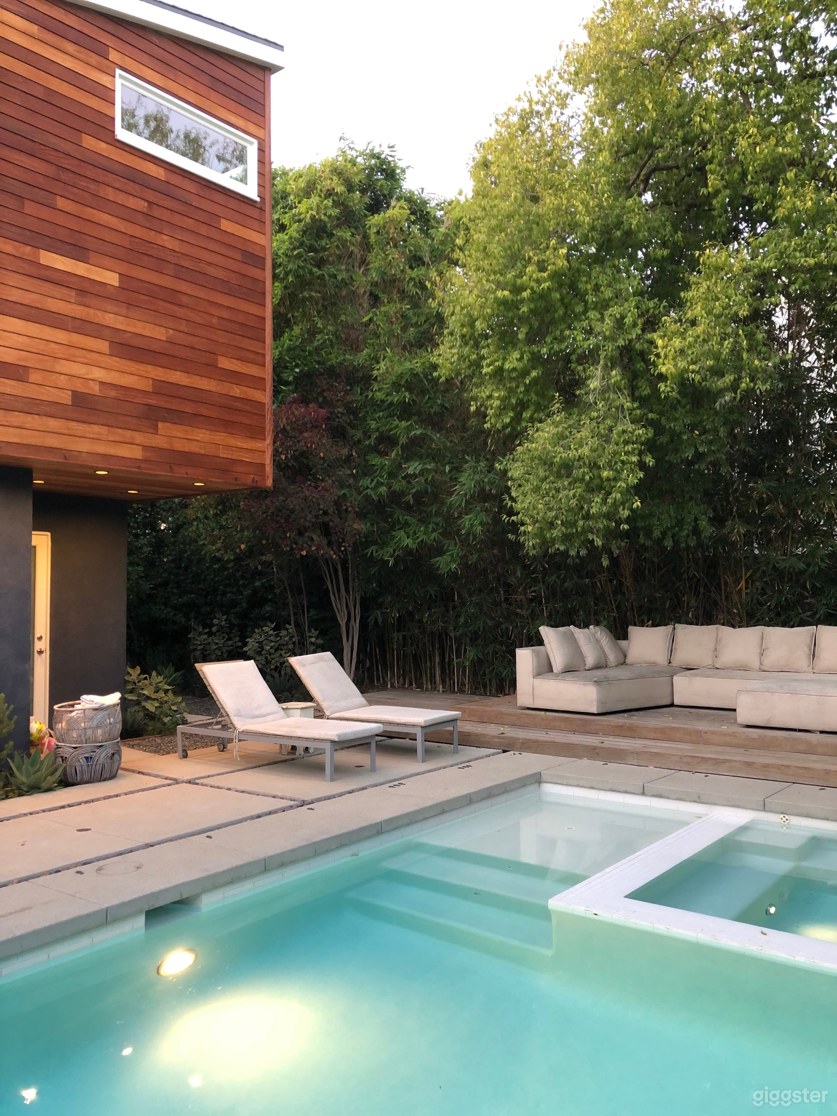Modern house, pool, trees and green landscaping.  Photo 4
