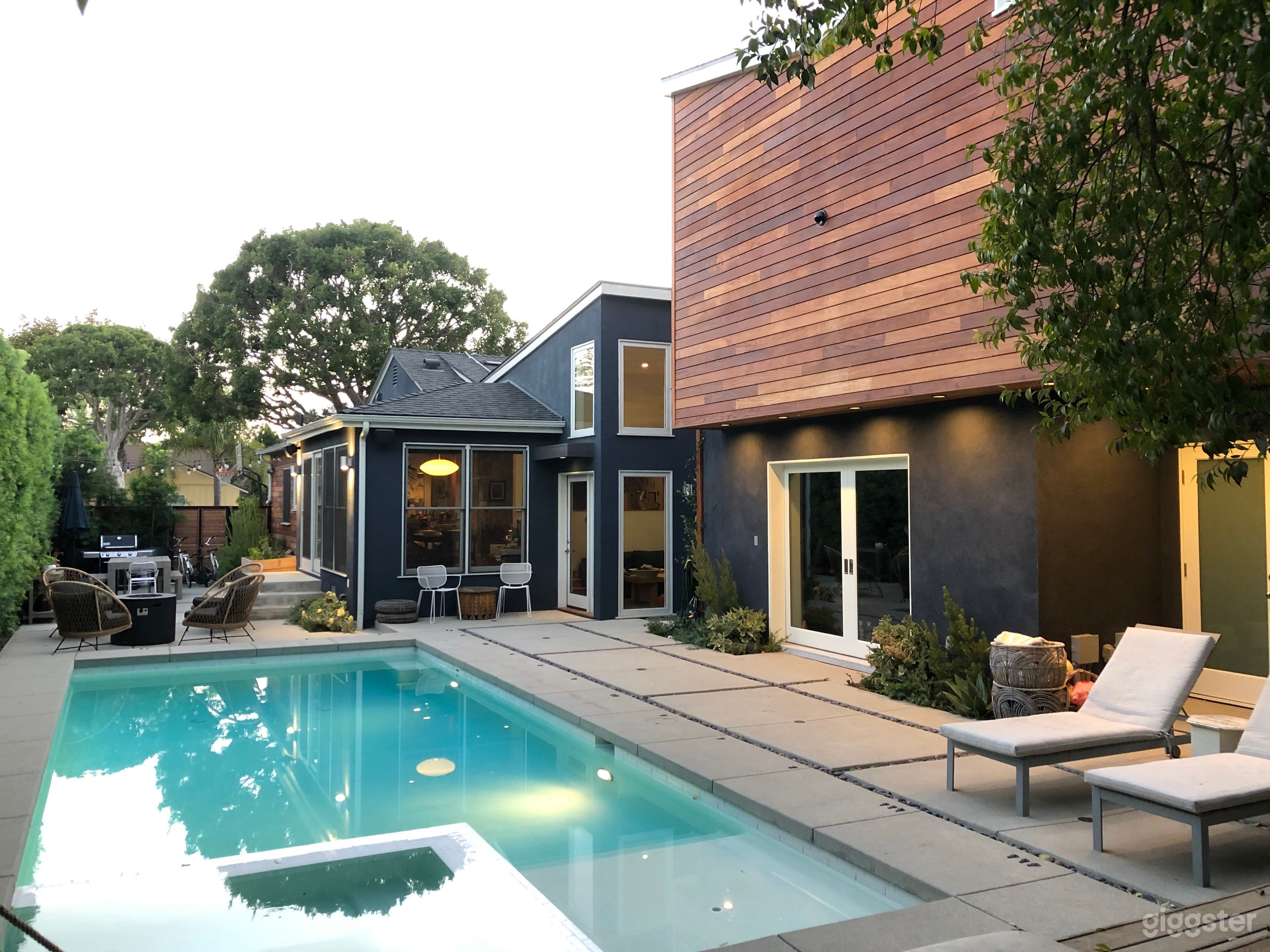 Modern house, pool, trees and green landscaping.  Photo 1