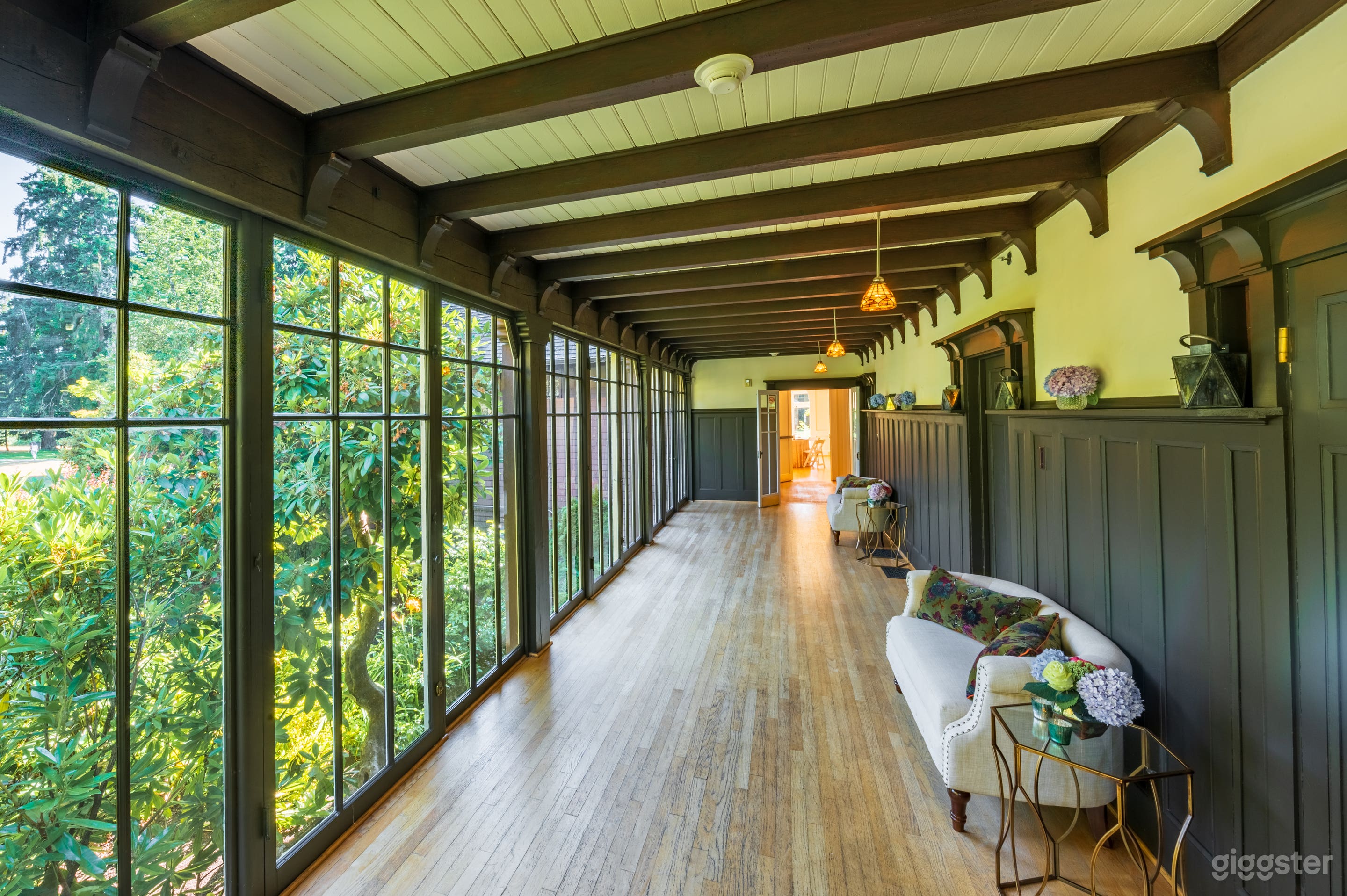 Sun Room with floor to ceiling windows that looks over the garden and the park.