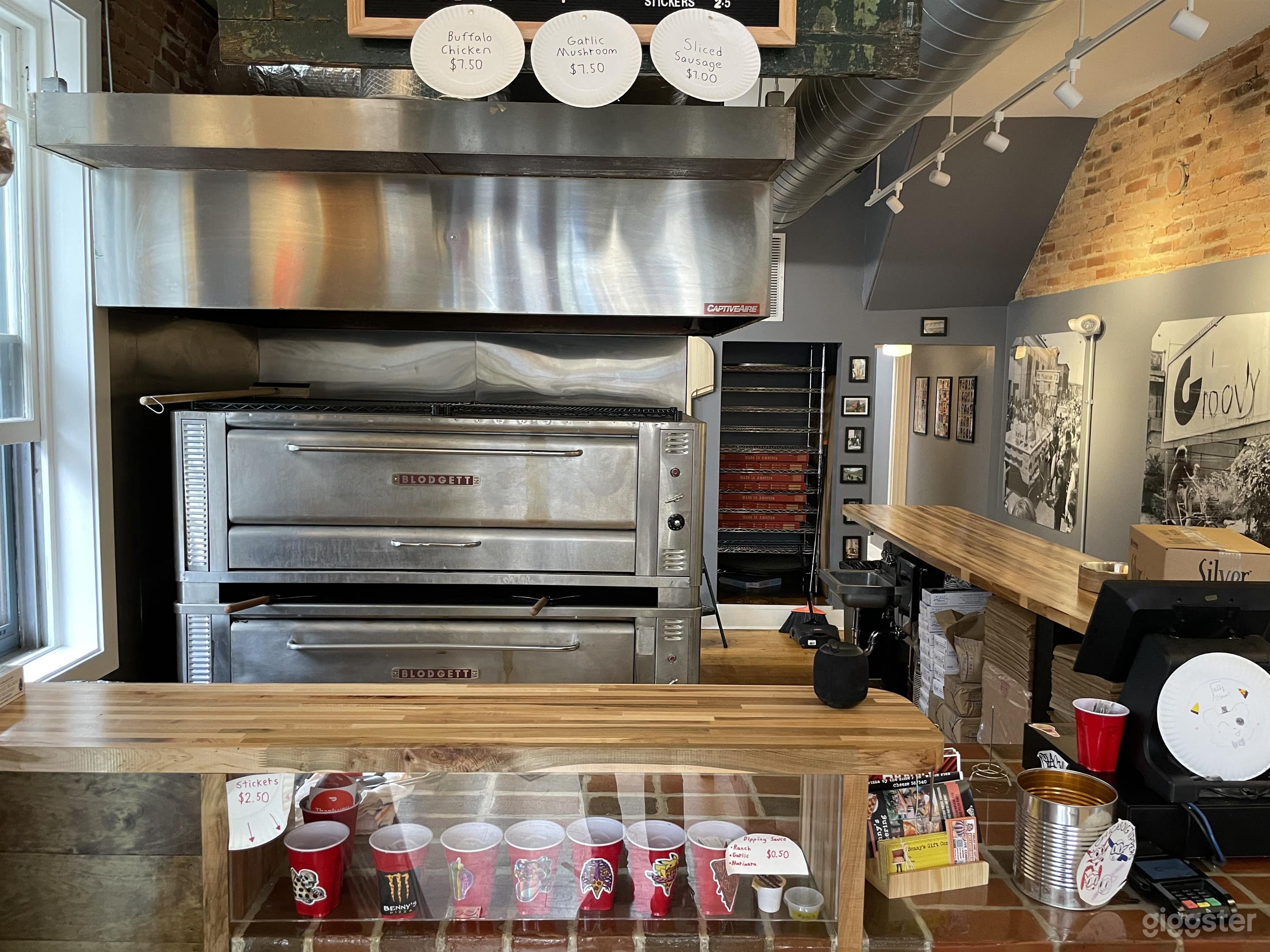 Open kitchen pumping out classic, massive 'by the slice' pizzas 