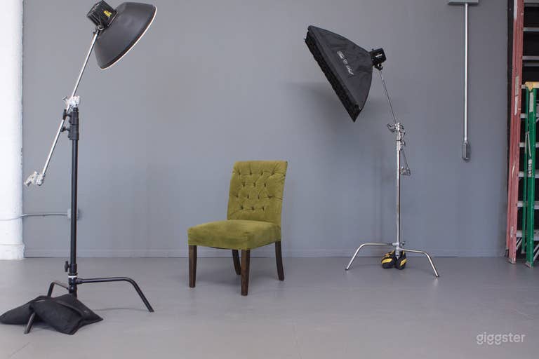  Gray wall, with un-painted warehouse floor.  Great for dark moody lighting.  