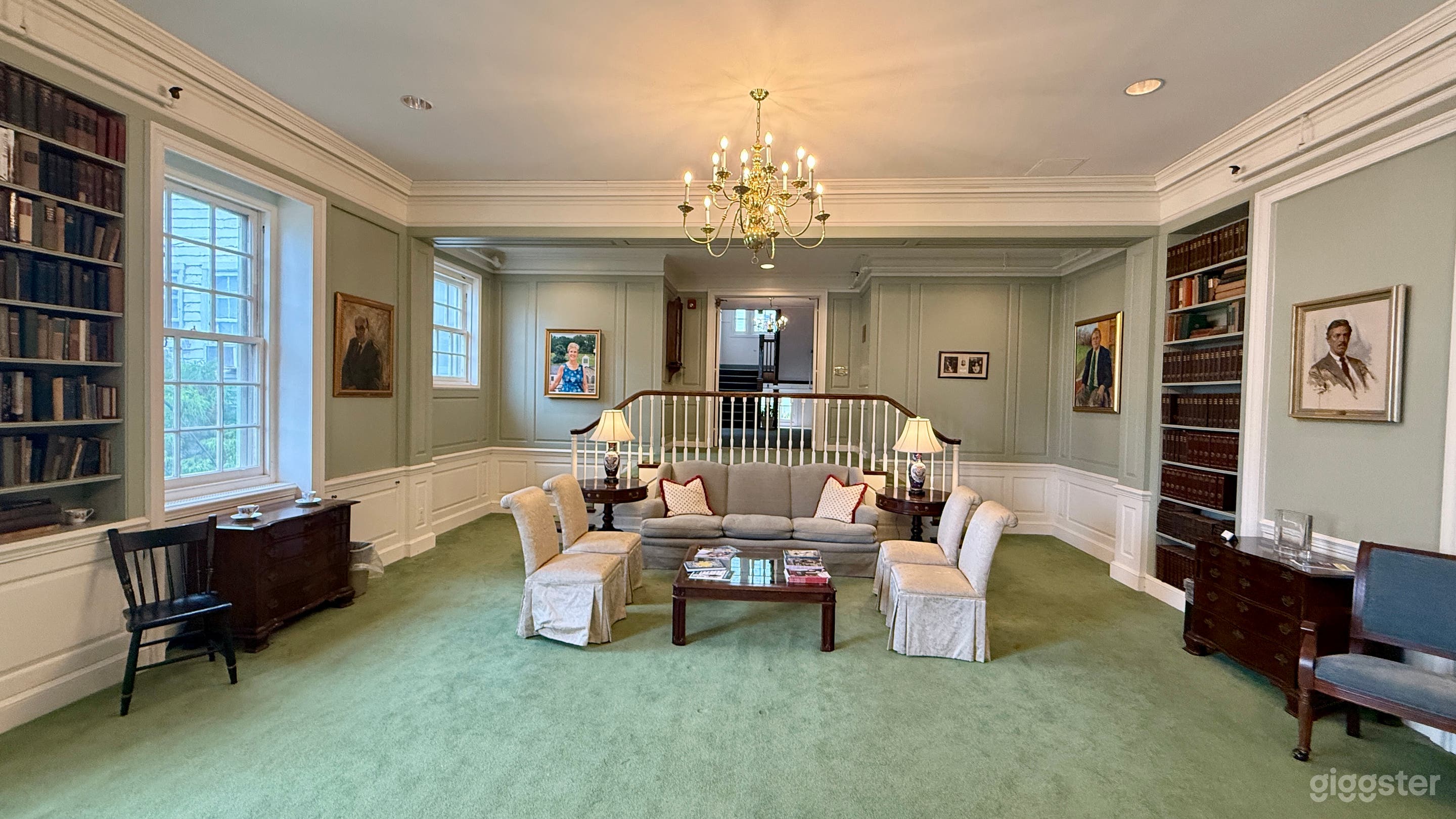 Inviting Living Sitting Room with Fireplace and Twin Stairs Photo 1