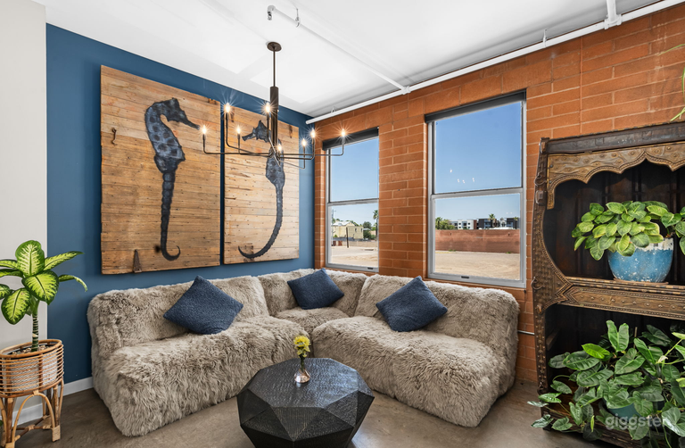  A common area on the main floor with a custom couch and coffee table.  It is a great place to relax and catch up with fellow guests.  