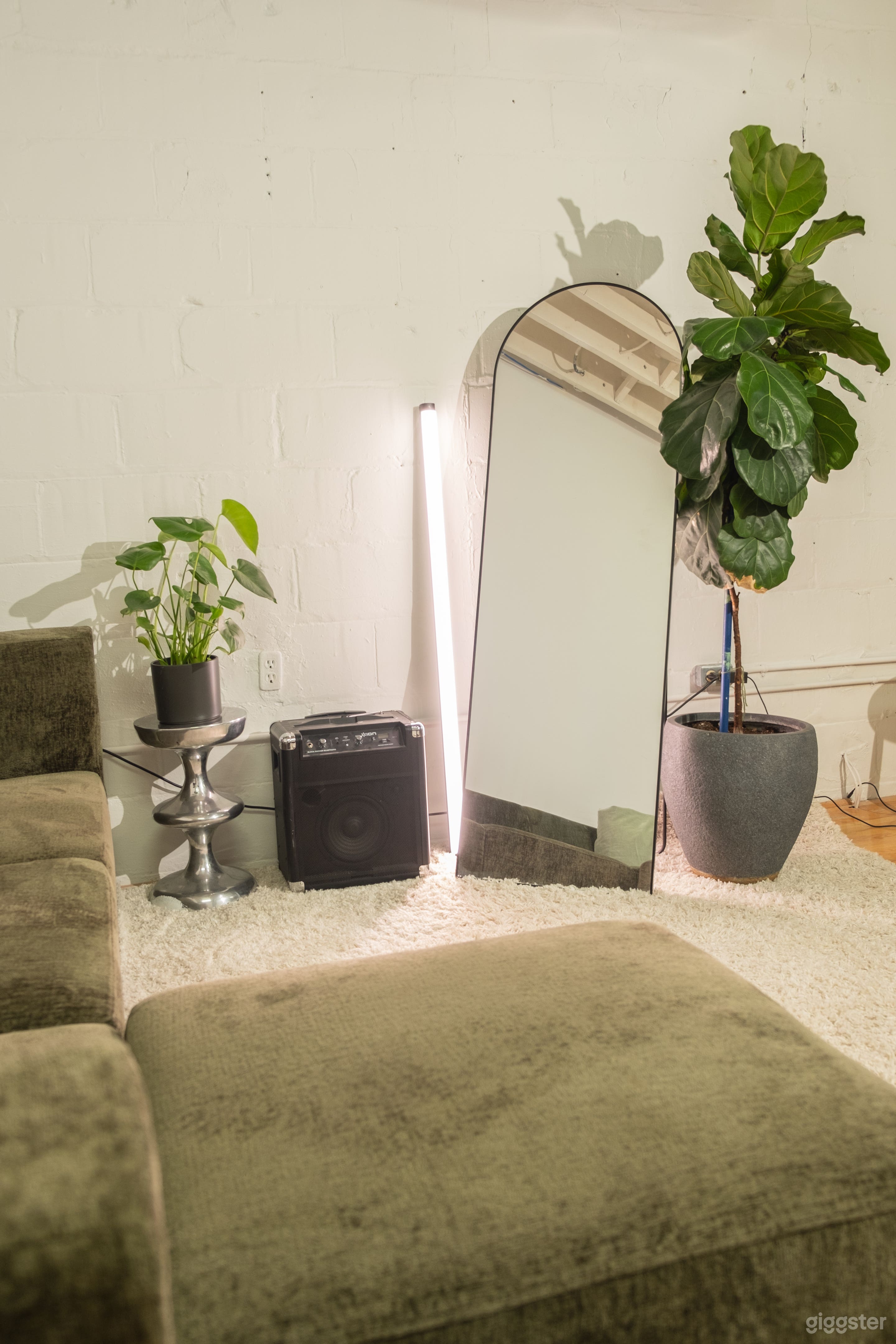 Industrial studio space - 15 x 30 Foot studio with flat white walls, dimmable string lights and equipment for rent