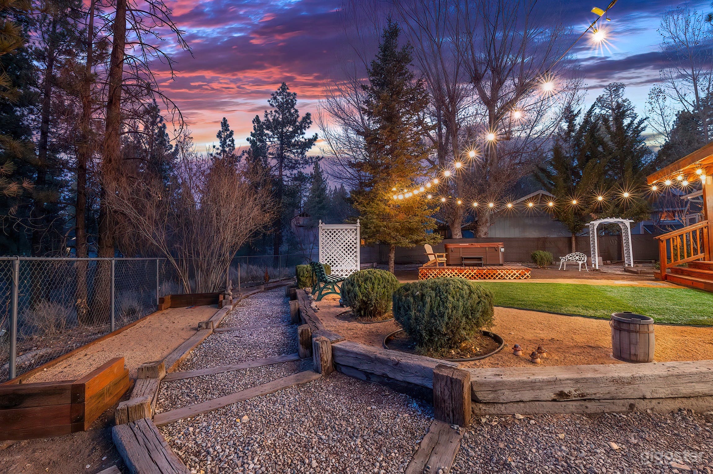 Picture perfect fully fenced backyard with mini horse shoes pit. 