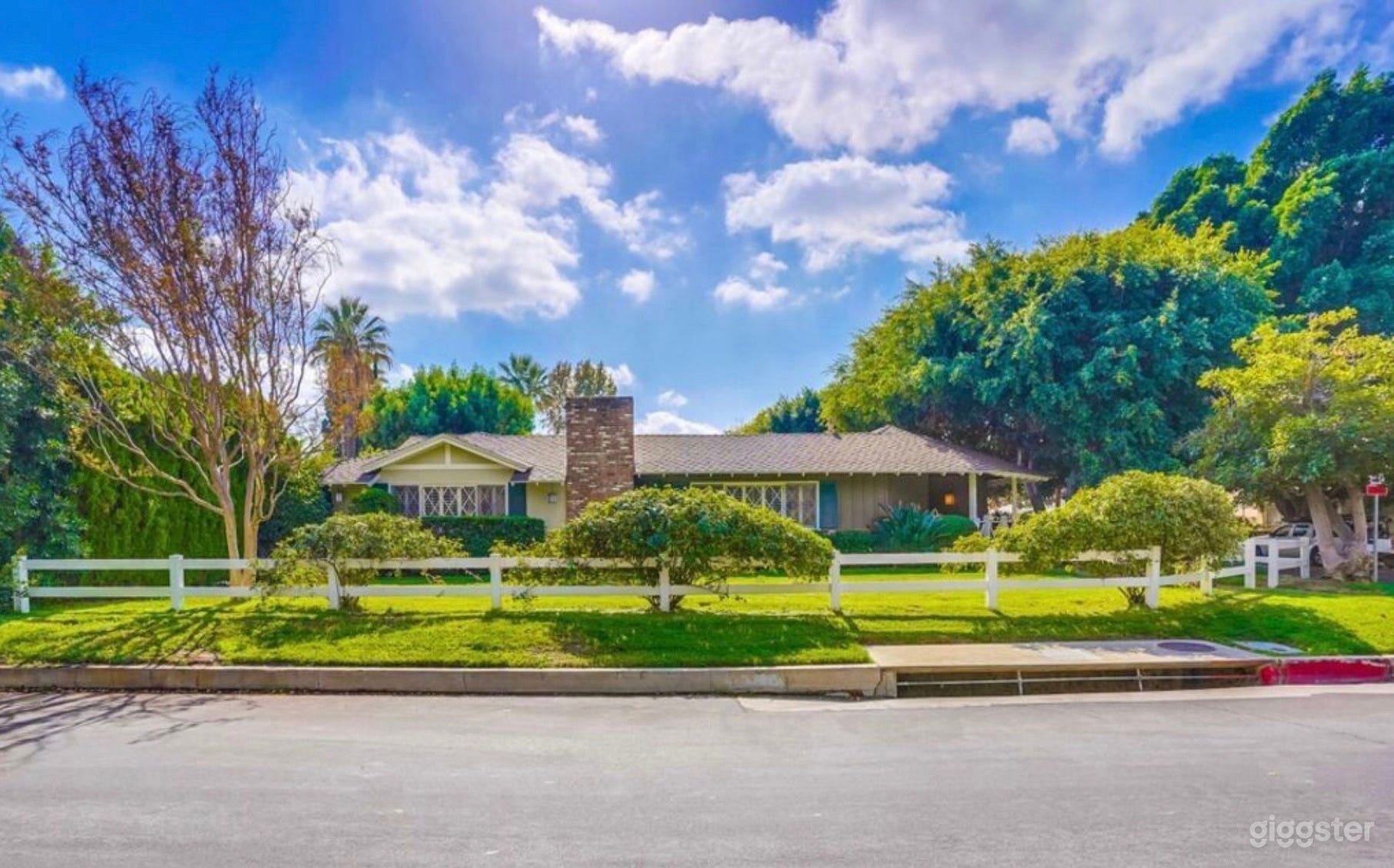 Mid-Century Ranch House with lush lawn and pool  Photo 2