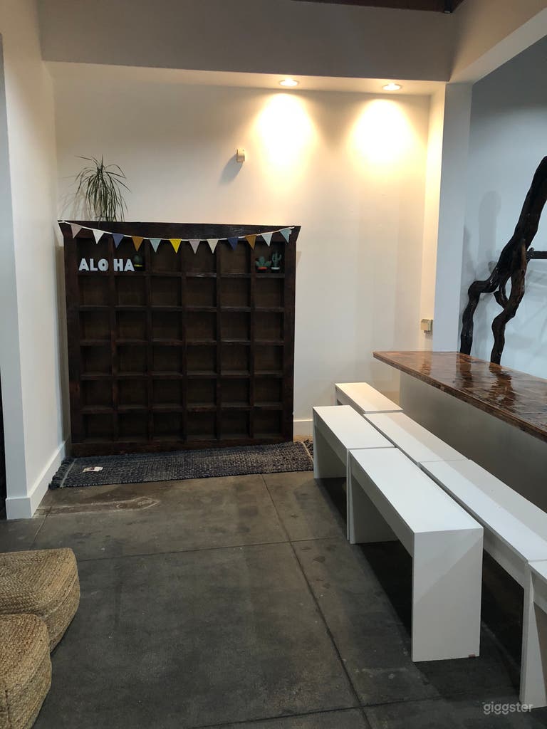 Lobby area with cement floor, reclaimed wood cubbies and countertop 