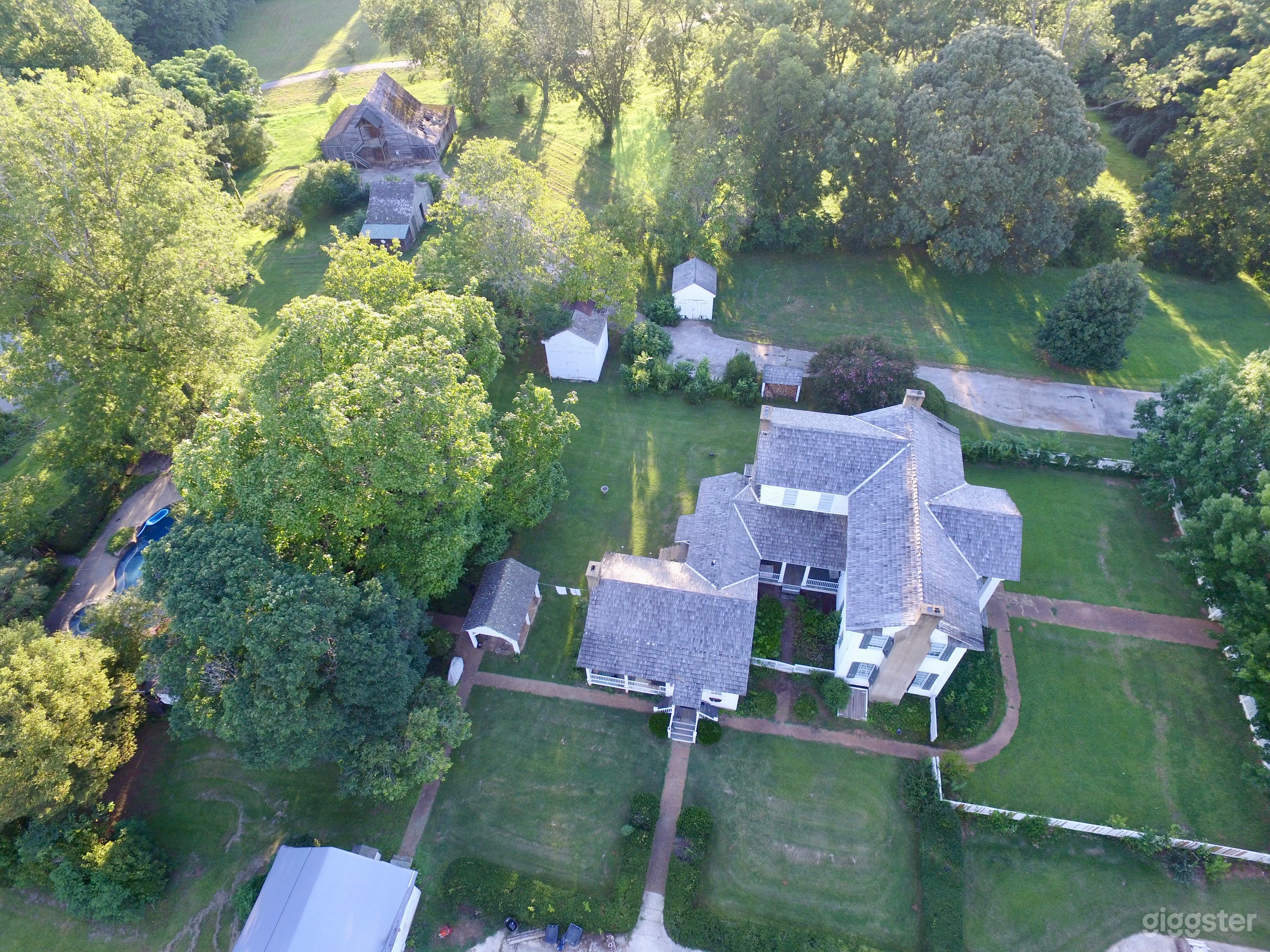 Aerial view of house &amp; barns
