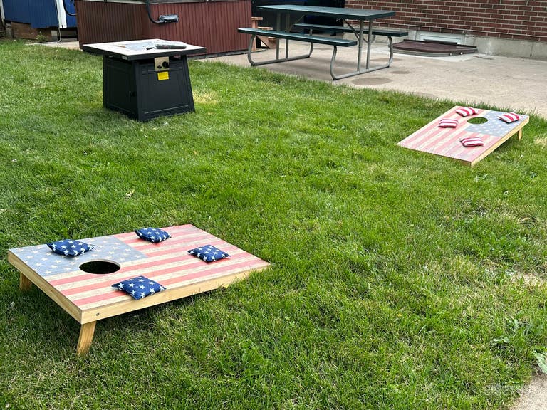  ️ Cornhole Challenge - Toss those beanbags and aim for victory! 