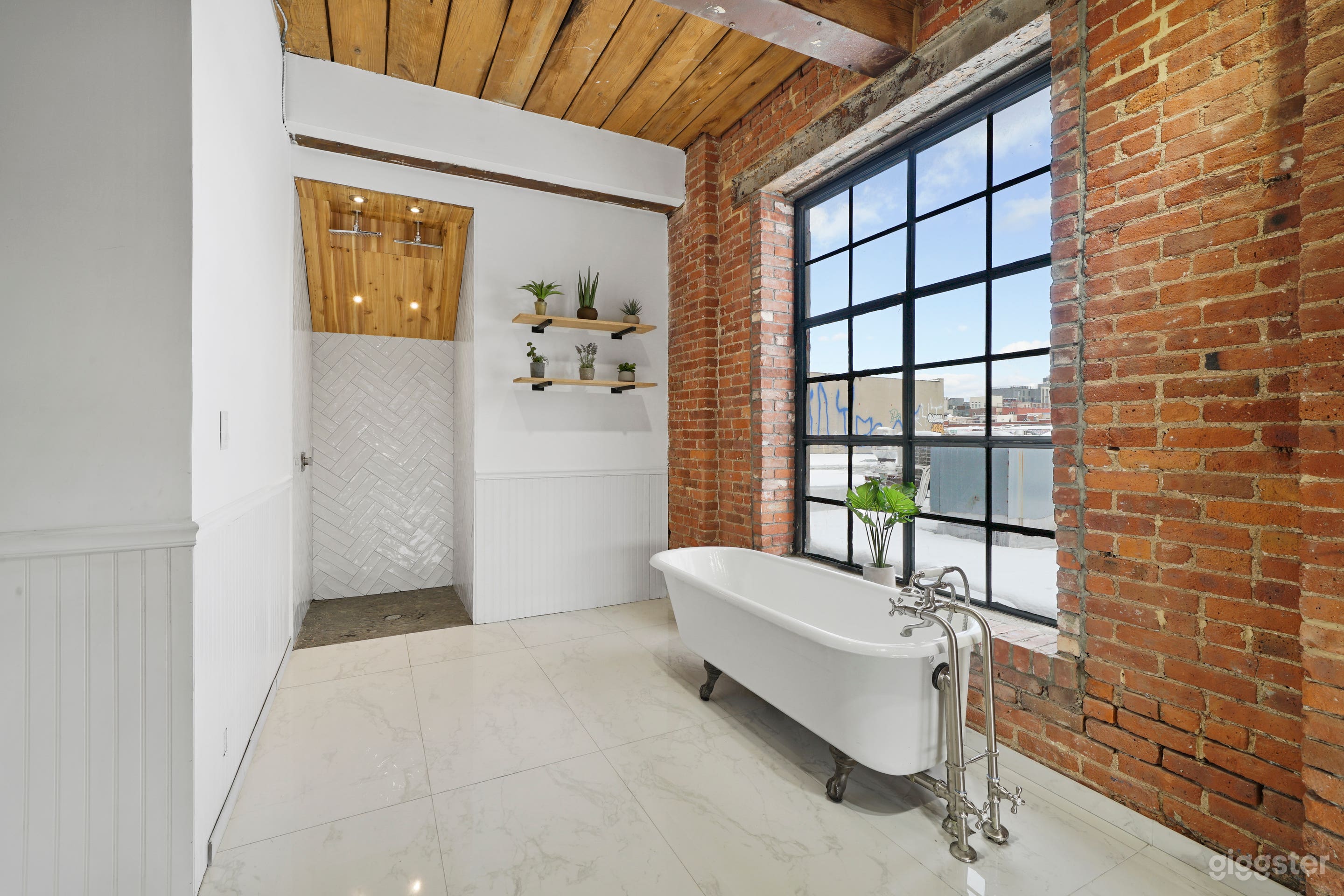 Elegant Clawfoot Tub and Historic Art Wall Photo 3