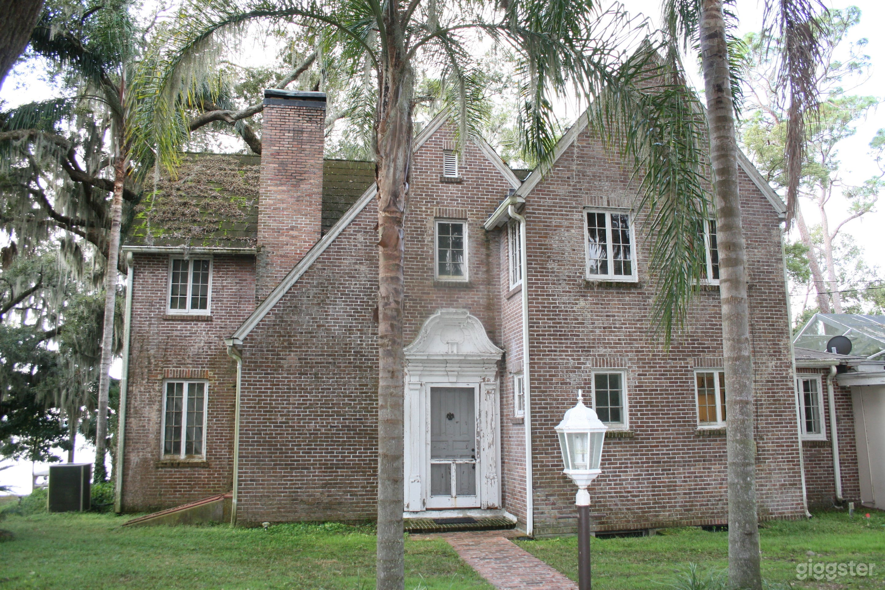 1930s Tudor style brick home with an attic and basement.
