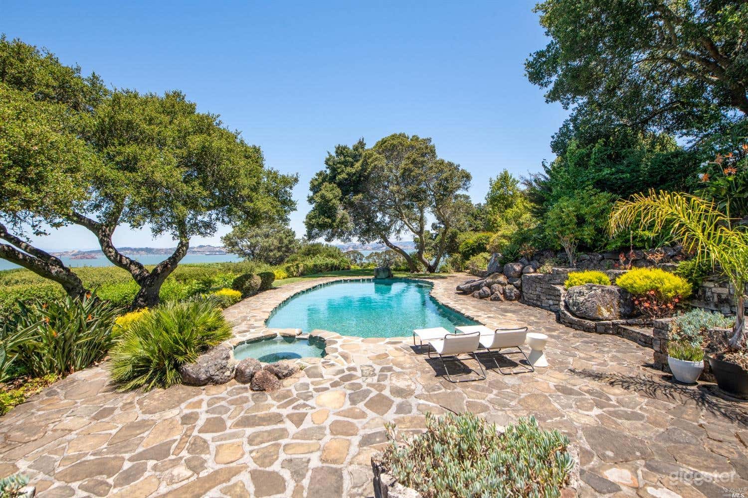 Over one acre of lush gardens with unobstructed water views and extreme privacy.