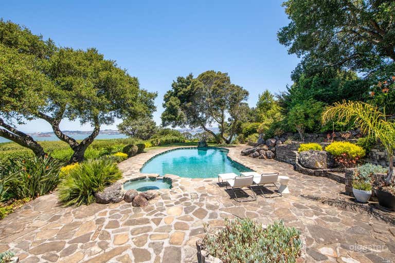  Over one acre of lush gardens with unobstructed water views and extreme privacy. 