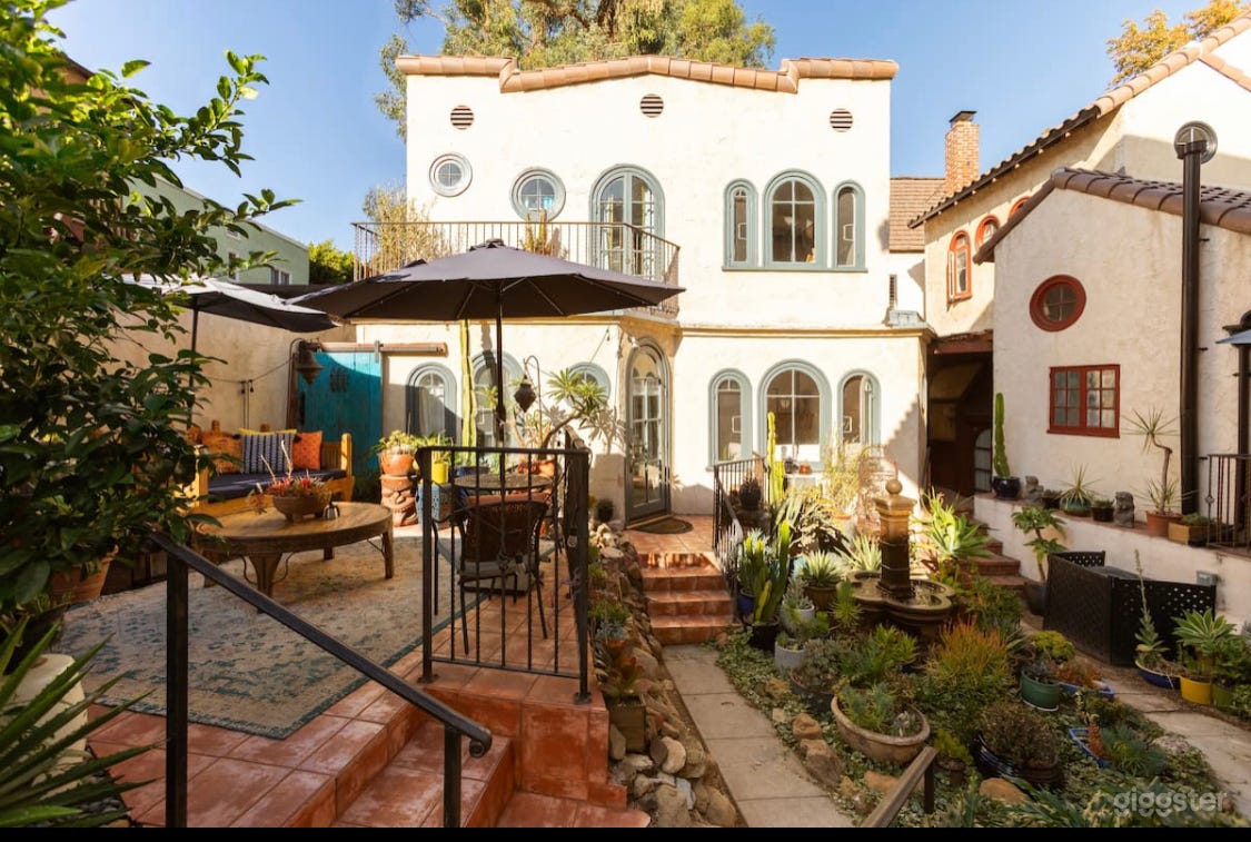 View of front of 2-story historical casita from the courtyard. *Blue trim has now been painted black