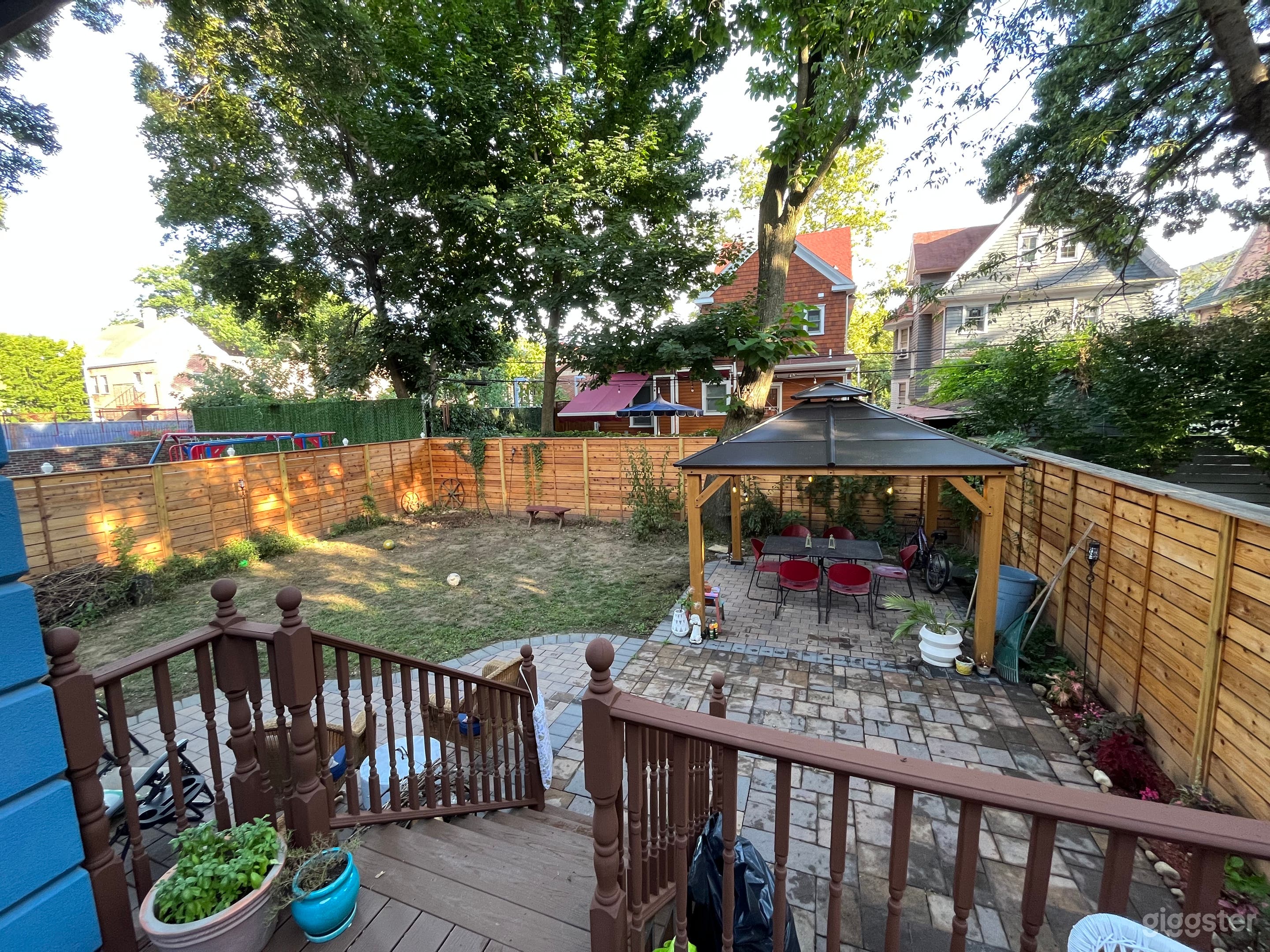 Fenced in large yard space with 11x11 gazebo. Power outlet on far side of gazebo and two at back of house. Large trees around yard.