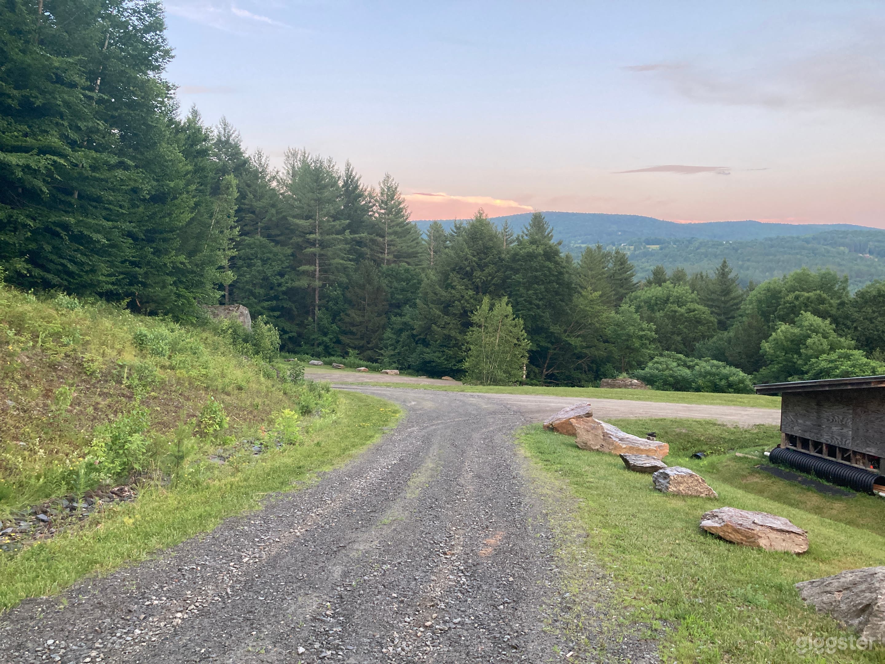Full functional 1 mile gravel road heading up from base camp house to meadow.