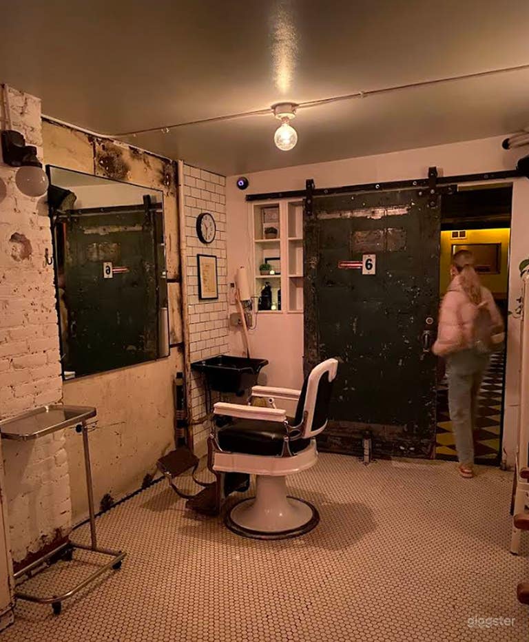  Sleek speakeasy lounge located behind barbershop 