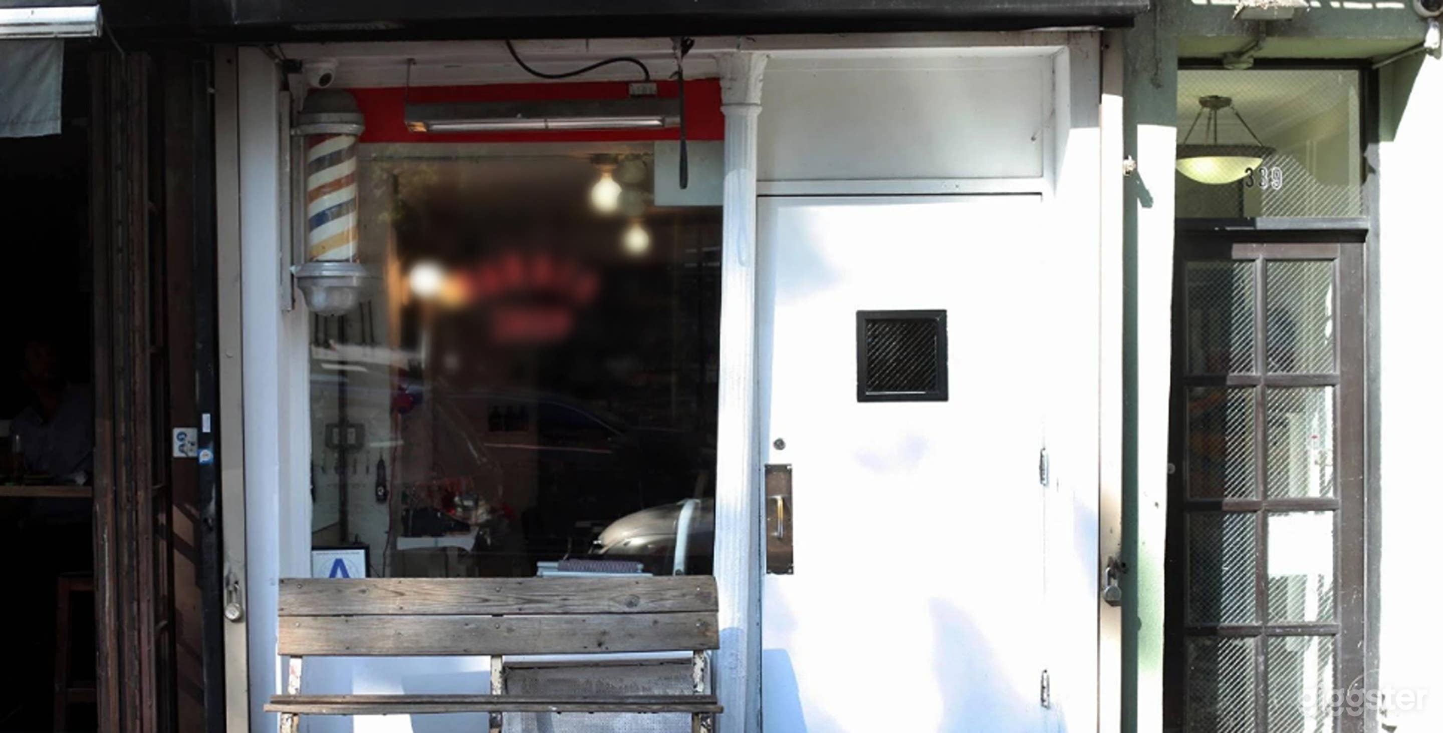 Sleek speakeasy lounge located behind barbershop Photo 3