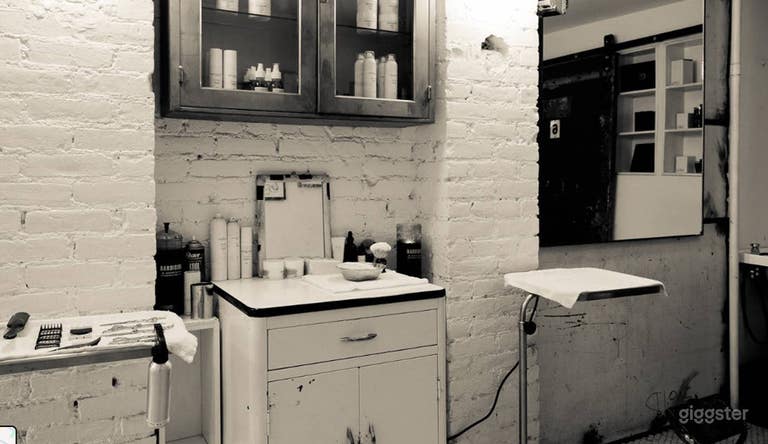  Sleek speakeasy lounge located behind barbershop 