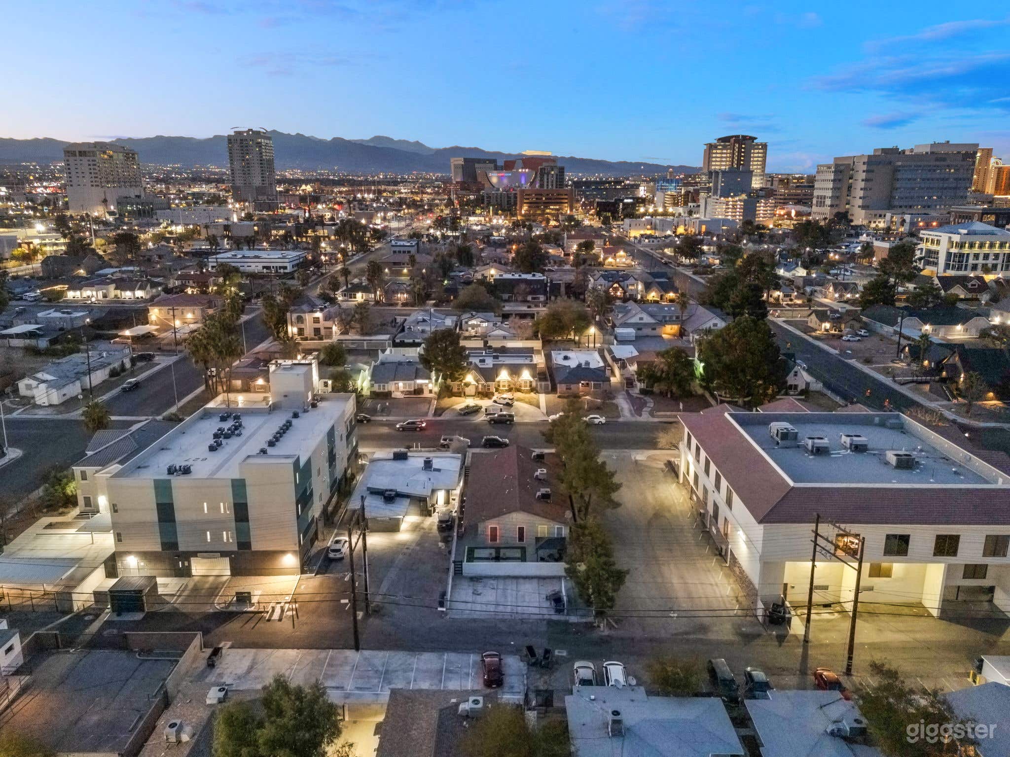 Aerial view of the rear of the property showing alley, surrounding neighborhood and Downtown Las Vegas.