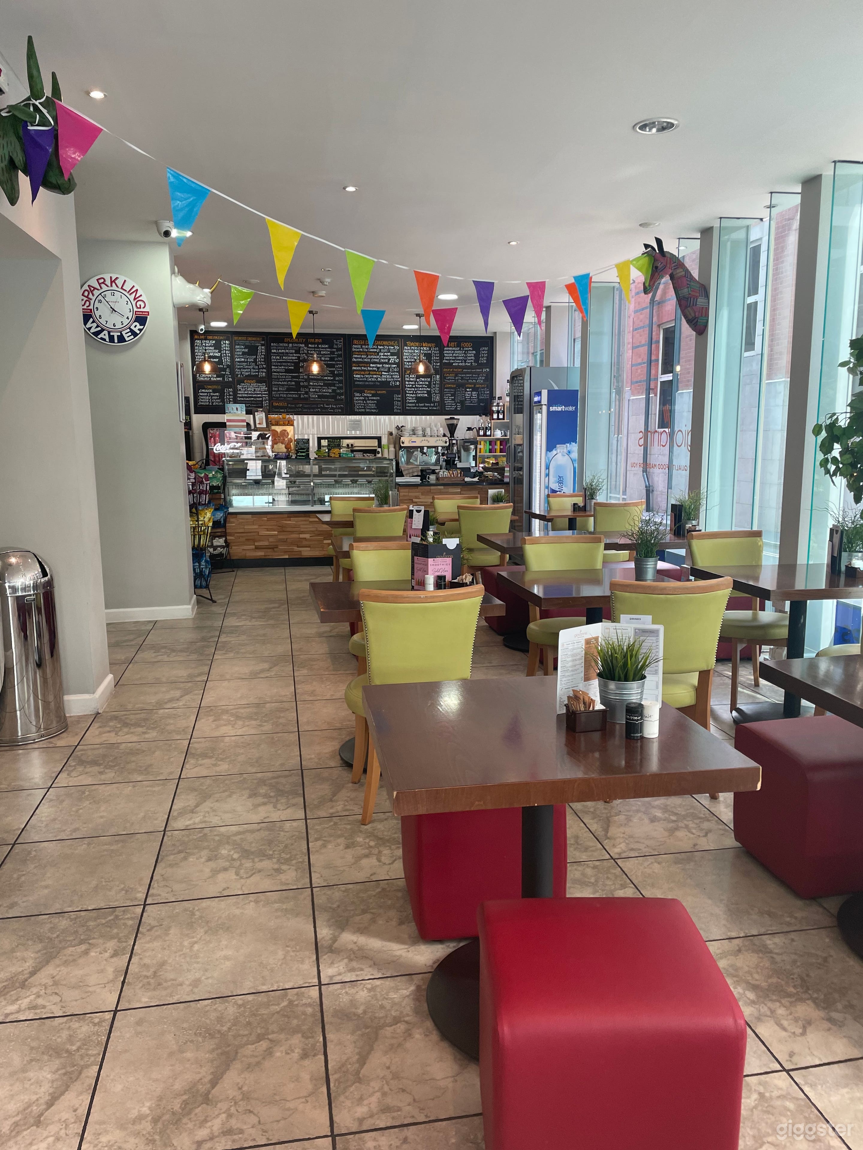 Modern Cafe with Floor to Ceiling Glass Window Photo 1