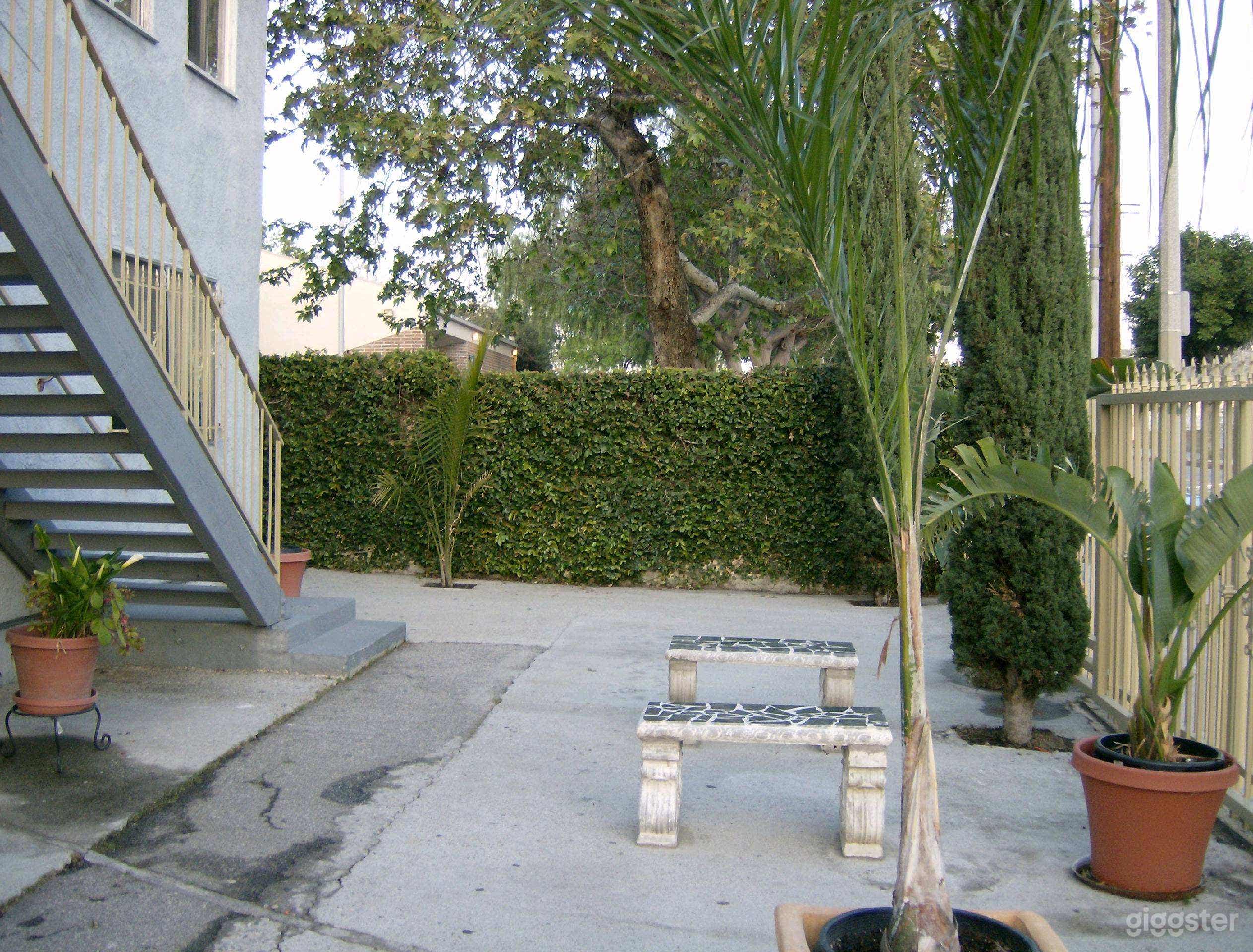 1 of 2 court yard seating area. There are more potted plants added after this picture was taken. Everything is movable according to request.