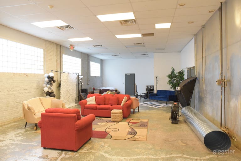  Q area- 1800 Sq ft.  Concrete floor, metal wall, block windows/ natural light. 