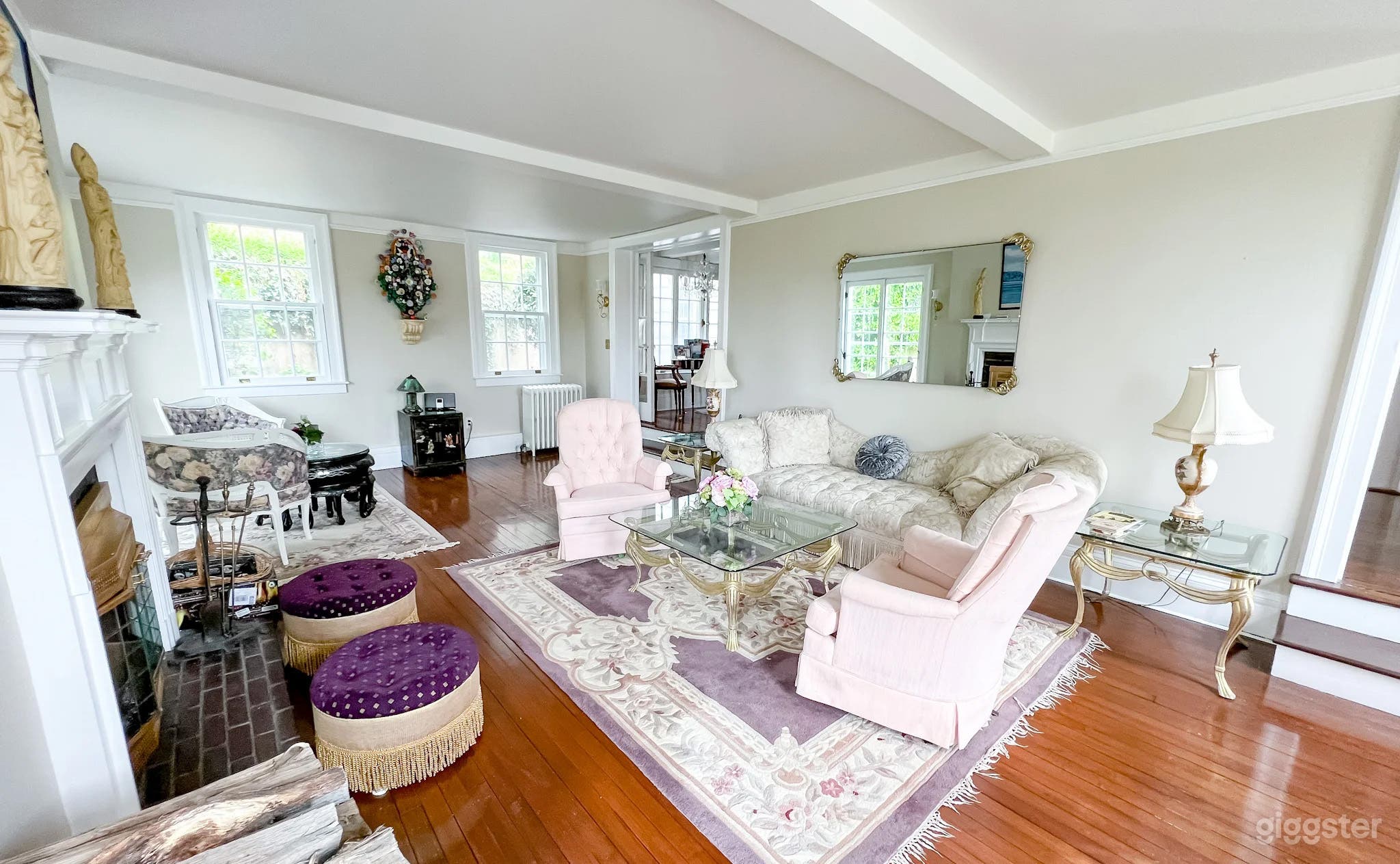 living room has 4 entrances and is 27 feet long 3 sets of french doors and 4 windows 