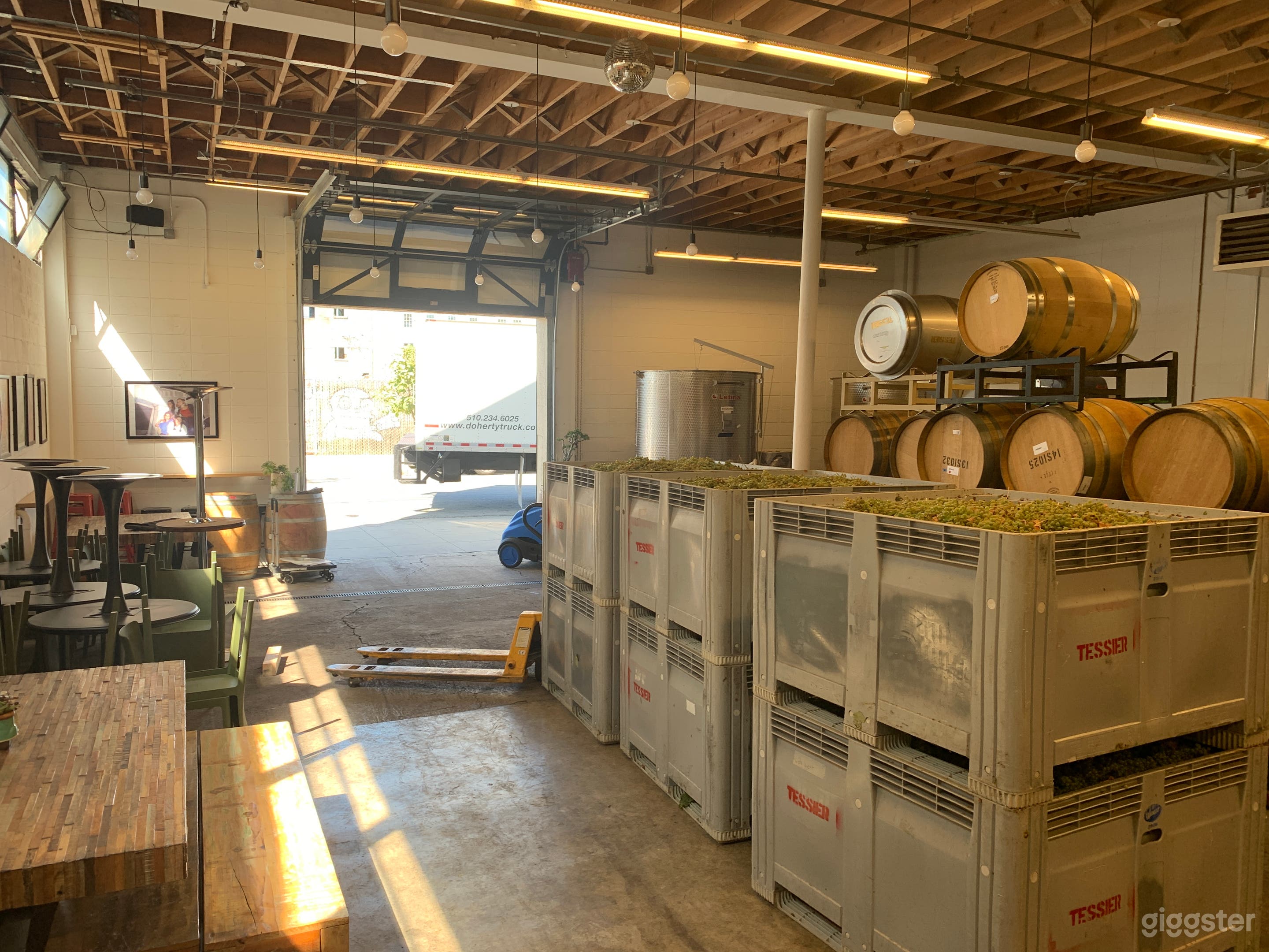 During harvest there is more equipment in the space and wine fermenting in bins and tanks 