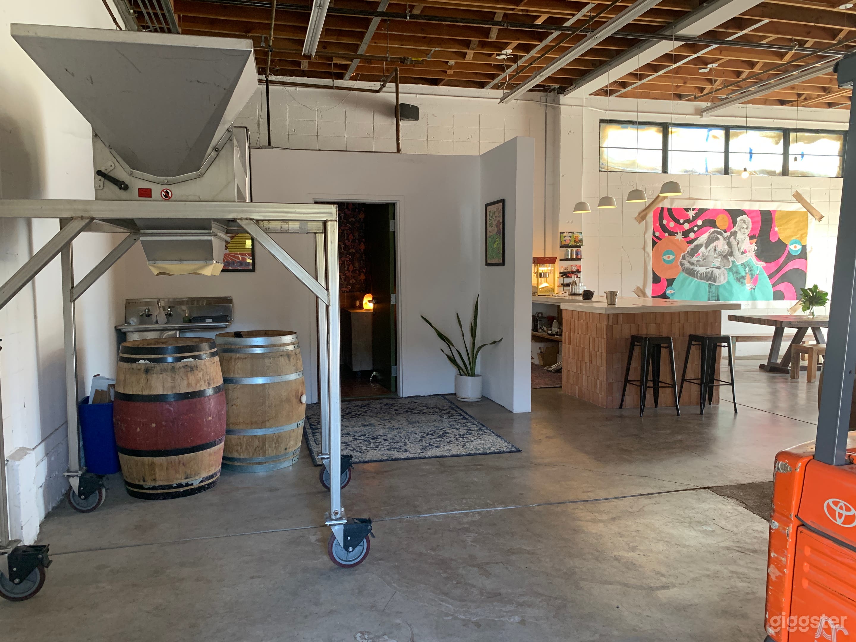 Bathroom through the door, bar to the right. The de-stemmer in the shot is mobile 