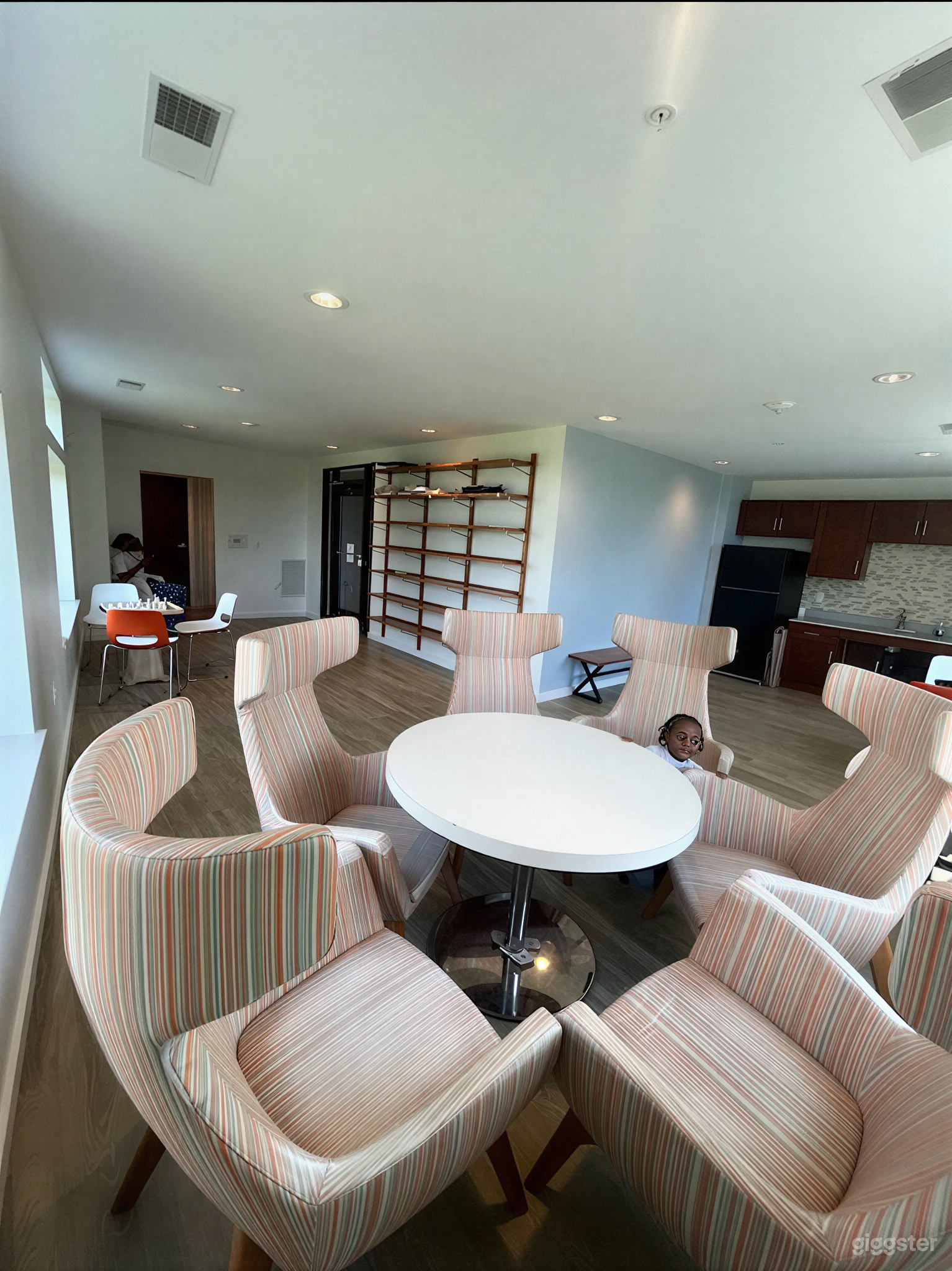 Modern Sunlit Meeting Room with High-Back Lounge Seating Photo 4